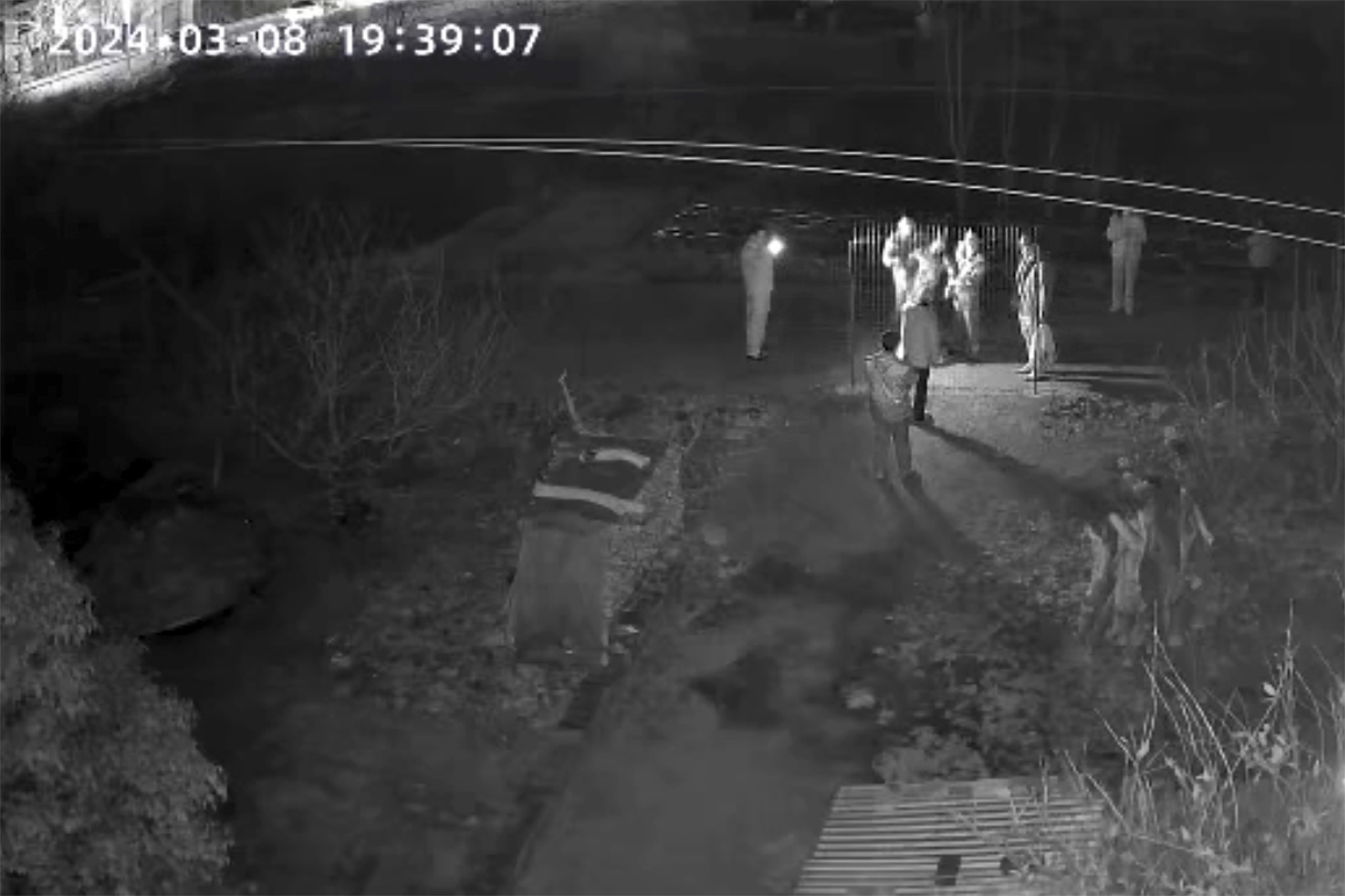 In this screen grab image from video, police officers hold up Yang Li as she is returned to her family home after she was knocked unconscious by masked police after petitioning in Beijing, Friday, March, 8, 2024, in Changzhou in eastern China's Jiangsu Province. (Yang Family - Yang Family)