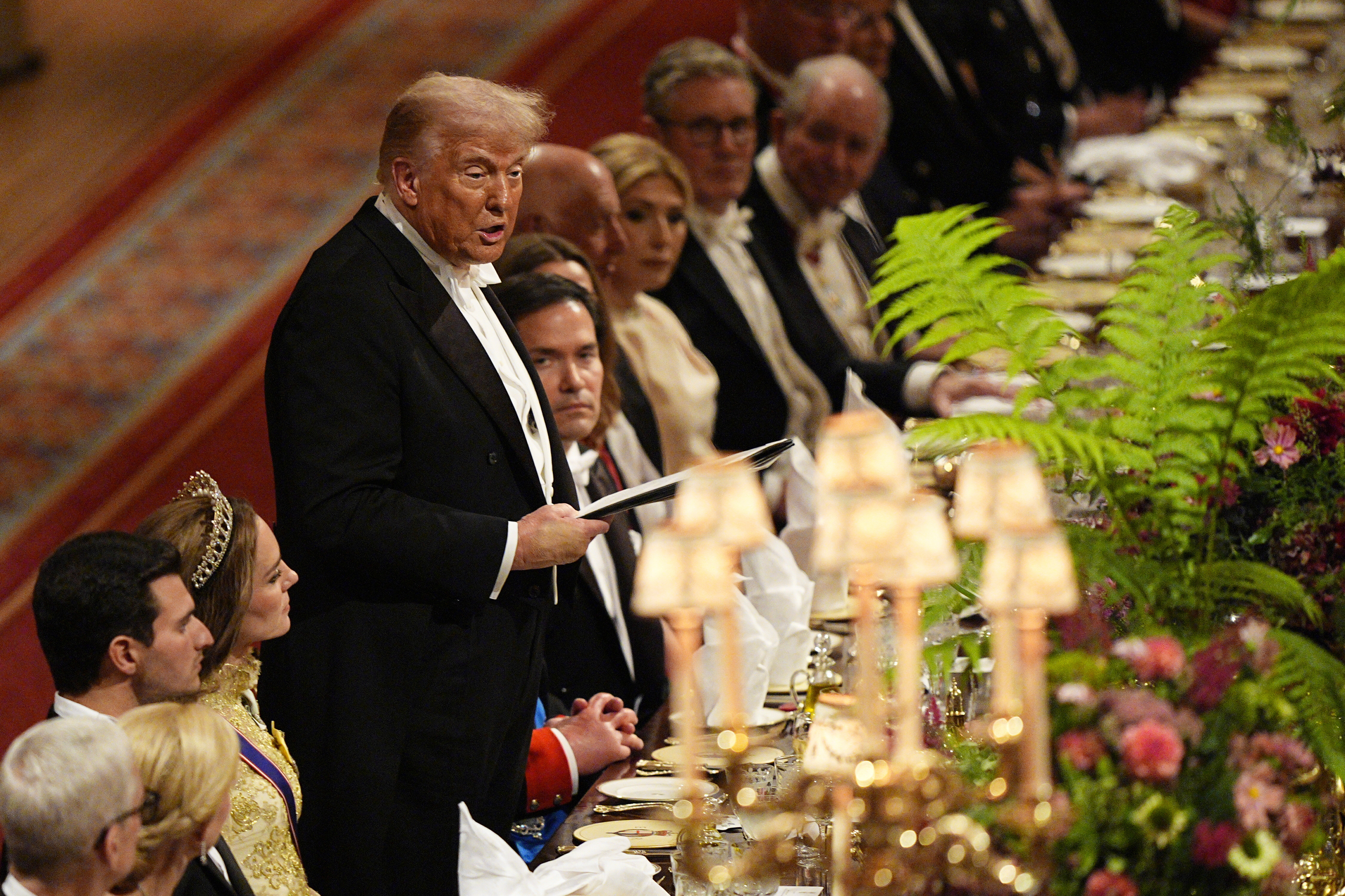 U.S. President Donald Trump, fourth left, listens as Britain's King Charles gives a speech during the State Banquet in Windsor Castle, England, on day one of U.S. President Donald Trump and First Lady Melania Trump's second state visit to the UK, Wednesday Sept. 17, 2025. (Aaron Chown - Pool PA)