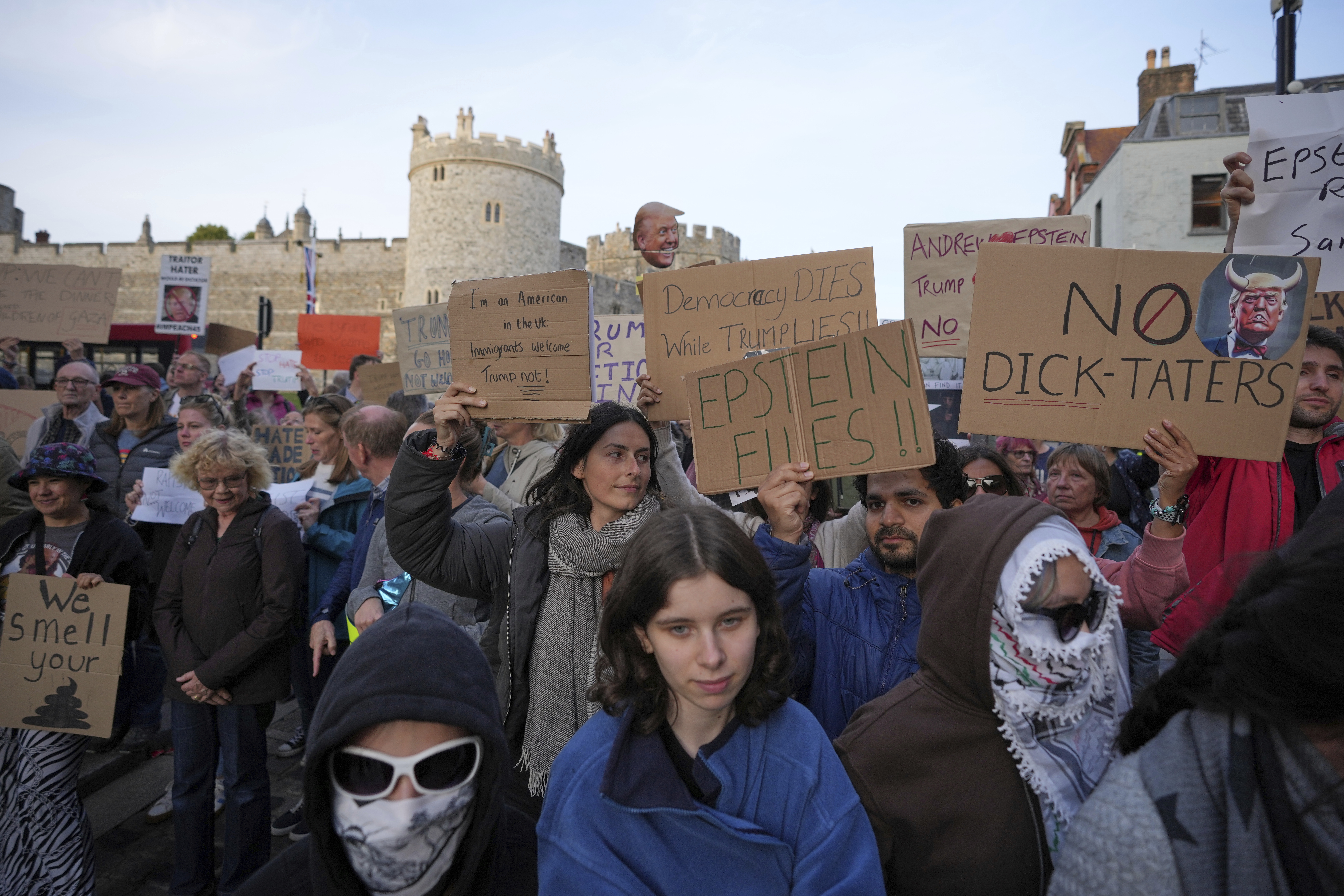 Protesters gather for a demonstration ahead of the arrival of President Donald Trump in Windsor, England, Tuesday, Sept. 16, 2025. (Kin Cheung - AP)