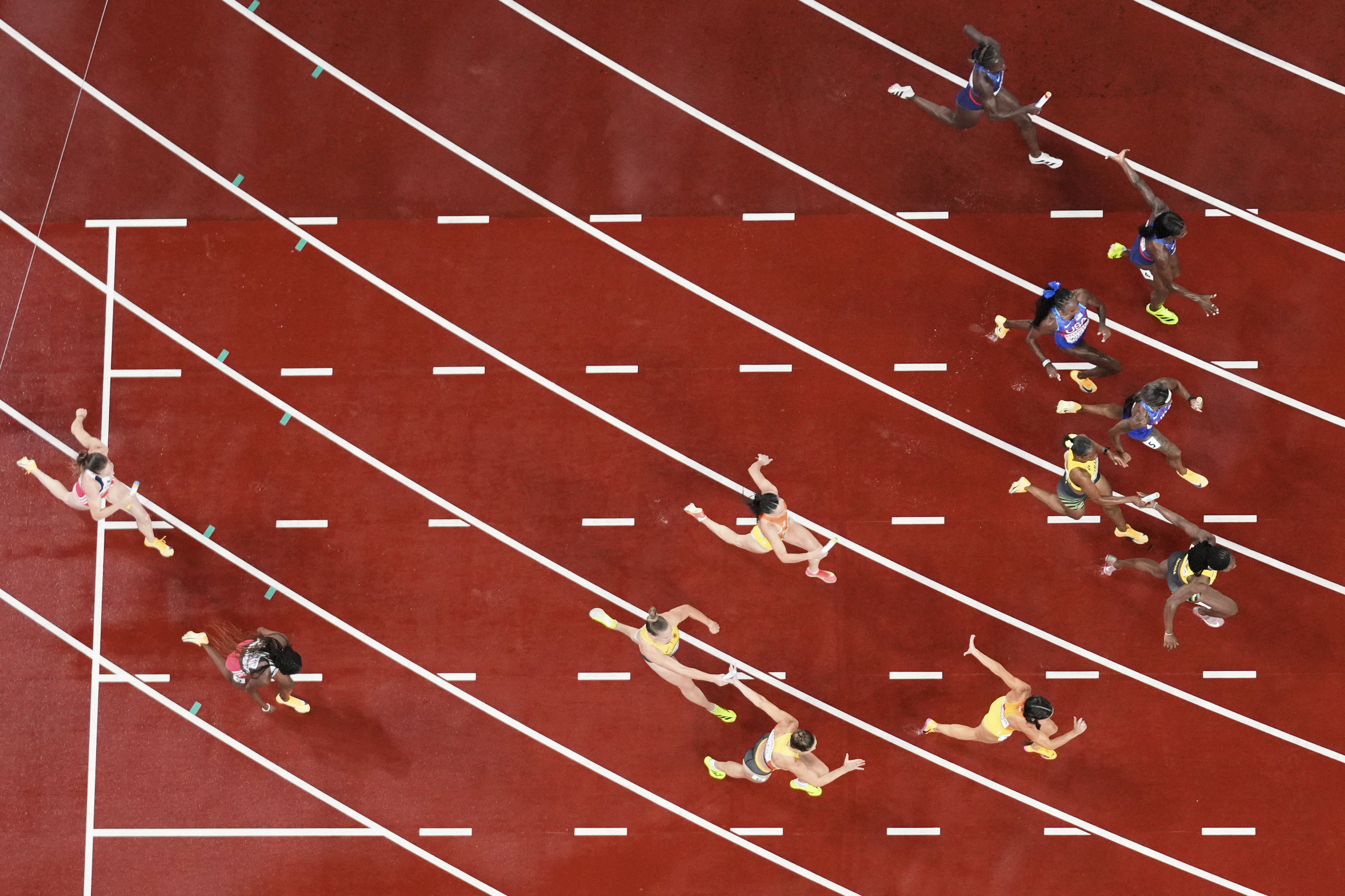 Athletes compete in the women's 4 X 100 meters relay final at the World Athletics Championships in Tokyo, Sunday, Sept. 21, 2025. (Bernat Armangue - AP)