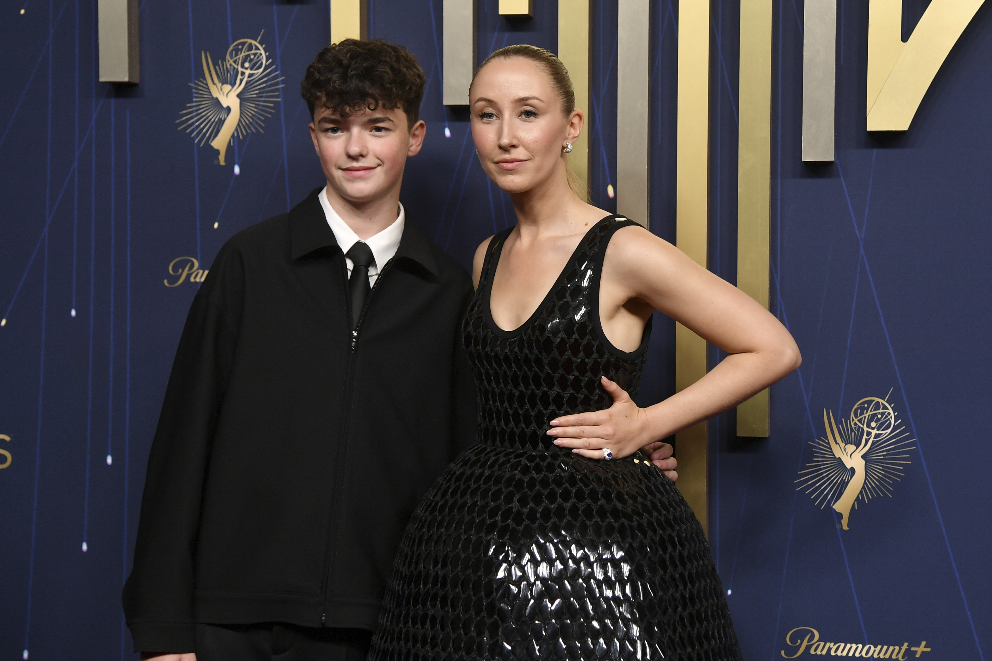 Owen Cooper, left, and Erin Doherty arrive at the 77th Primetime Emmy Awards on Sunday, Sept. 14, 2025, at the Peacock Theater in Los Angeles. (Richard Shotwell - Invision)