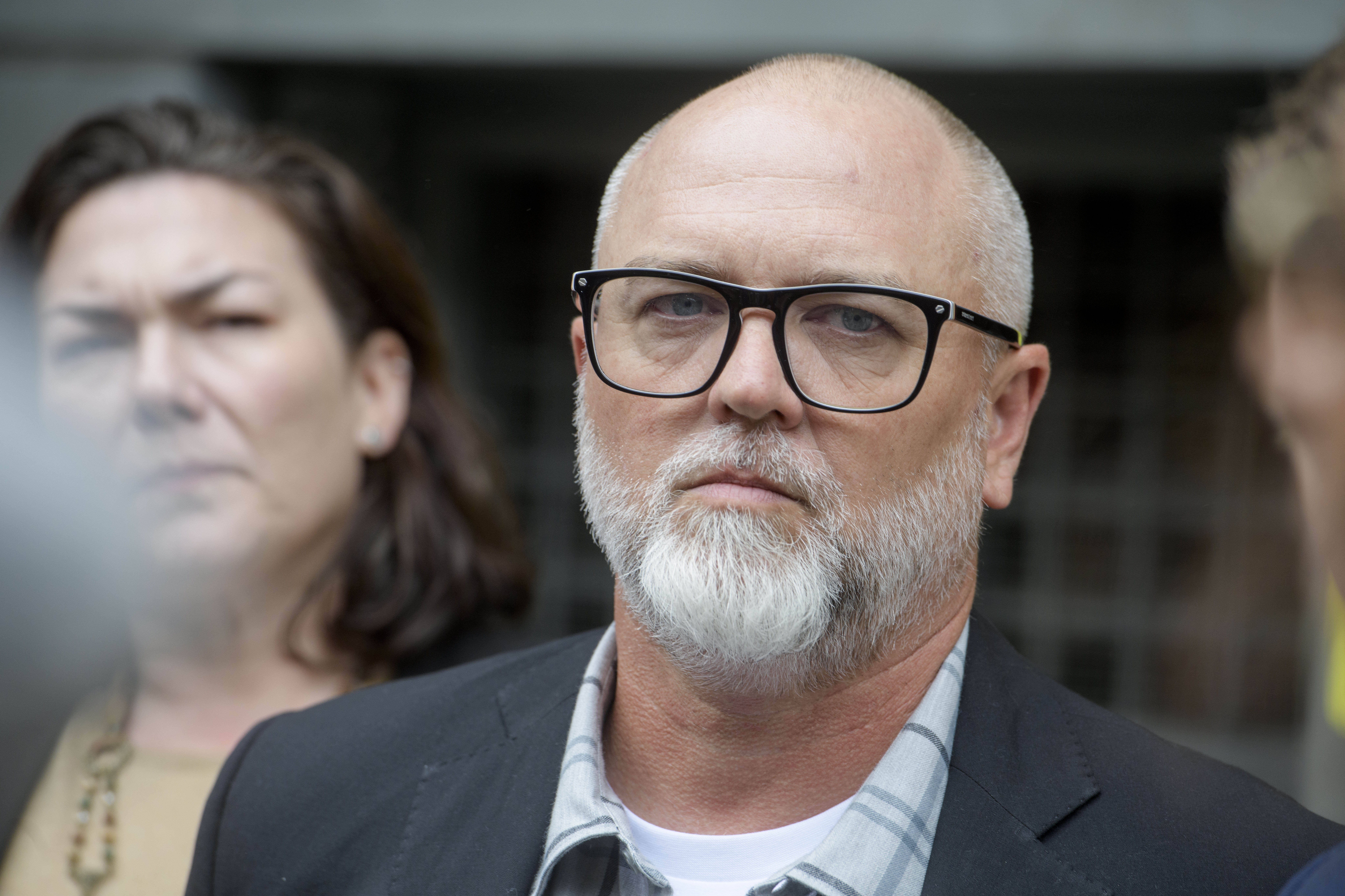 Jan Carey, a North Carolina veteran who burned a flag near the White House last month, listens while his attorneys speak following his arraignment at the E. Barrett Prettyman Federal Courthouse, Wednesday, Sept. 17, 2025, in Washington. (Rod Lamkey - FR172078)