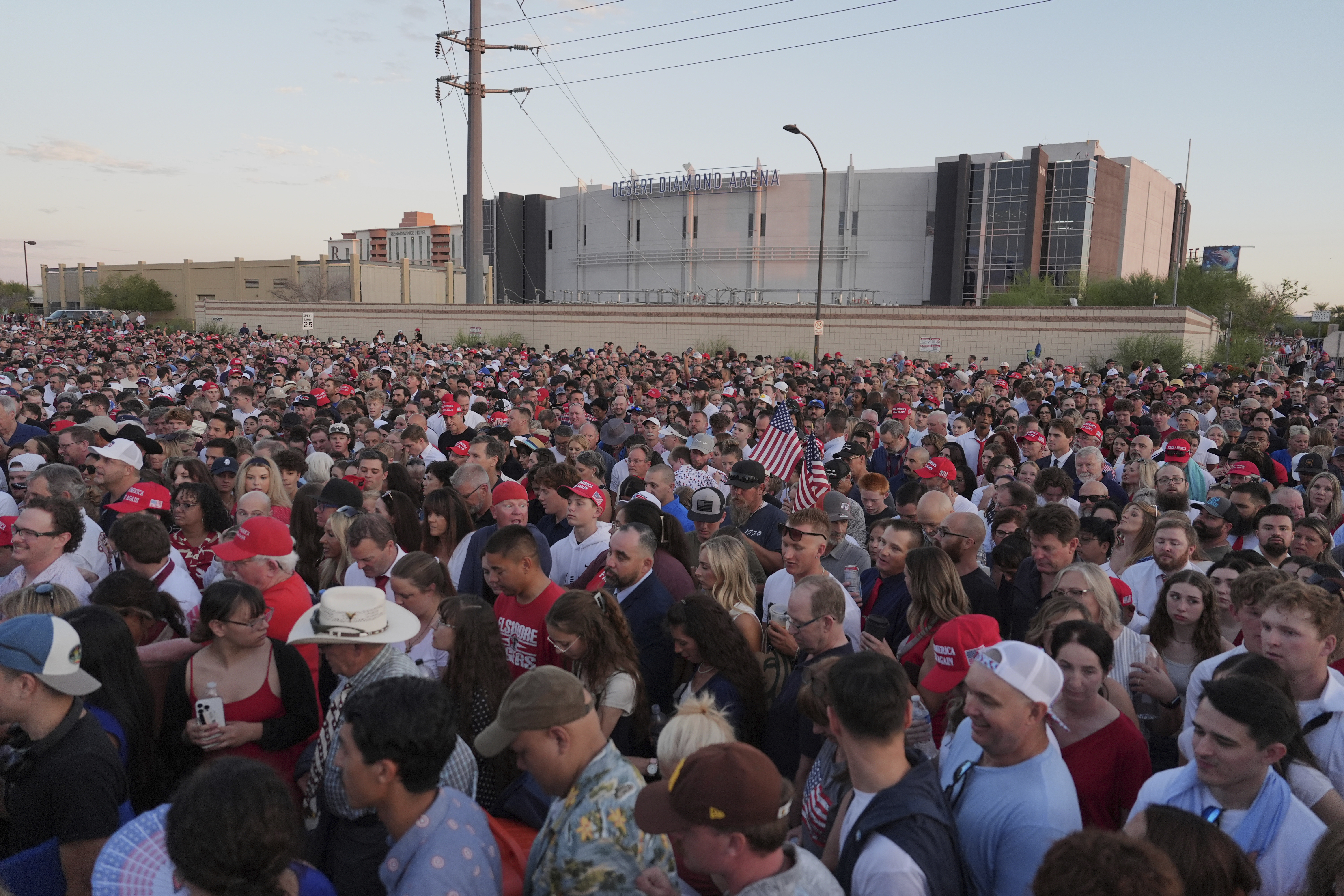 People wait in line before a memorial for conservative activist Charlie Kirk Sunday, Sept. 21, 2025, at State Farm Stadium in Glendale, Ariz. (Jae C. Hong - AP)