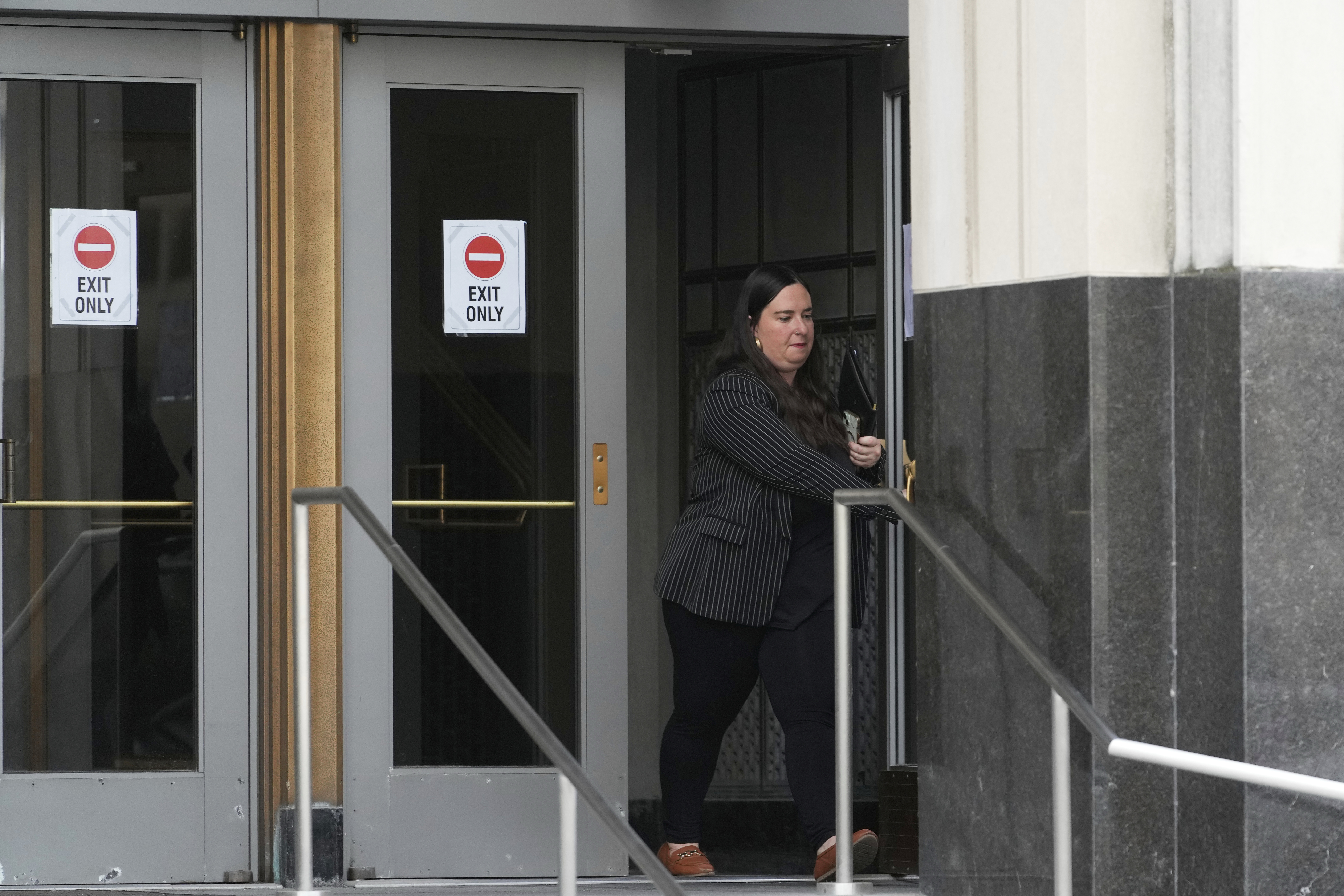 Sara Garber, attorney for Chengxuan Han, one of two Chinese scientists accused of smuggling or shipping biological material to the United States, leaves after a sentencing hearing at the U.S. District Court, Wednesday, Sept. 10, 2025, in Detroit. (Ryan Sun - AP)