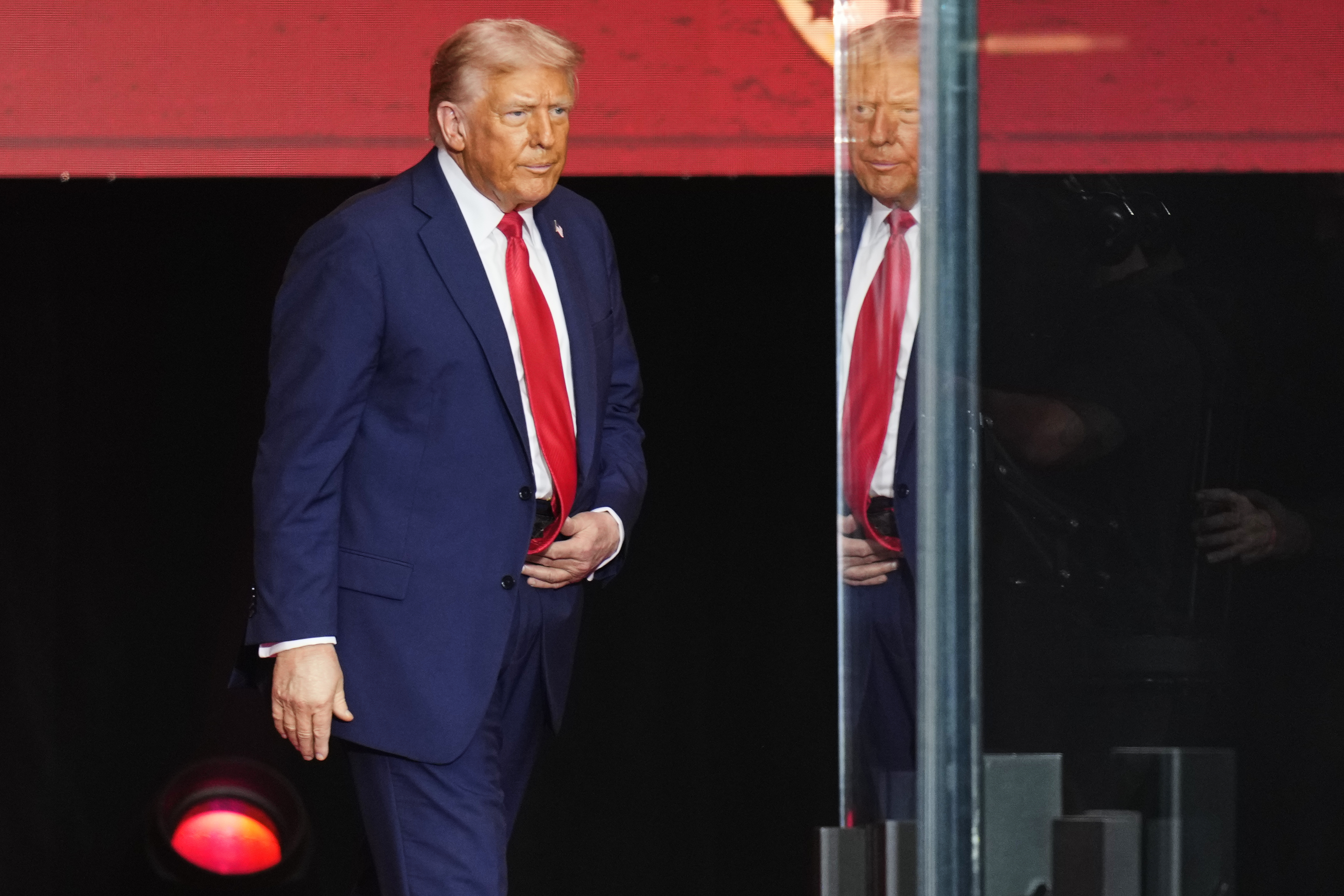 President Donald Trump arrives on stage to speak at a memorial for conservative activist Charlie Kirk, Sunday, Sept. 21, 2025, at State Farm Stadium in Glendale, Ariz. (John Locher - AP)