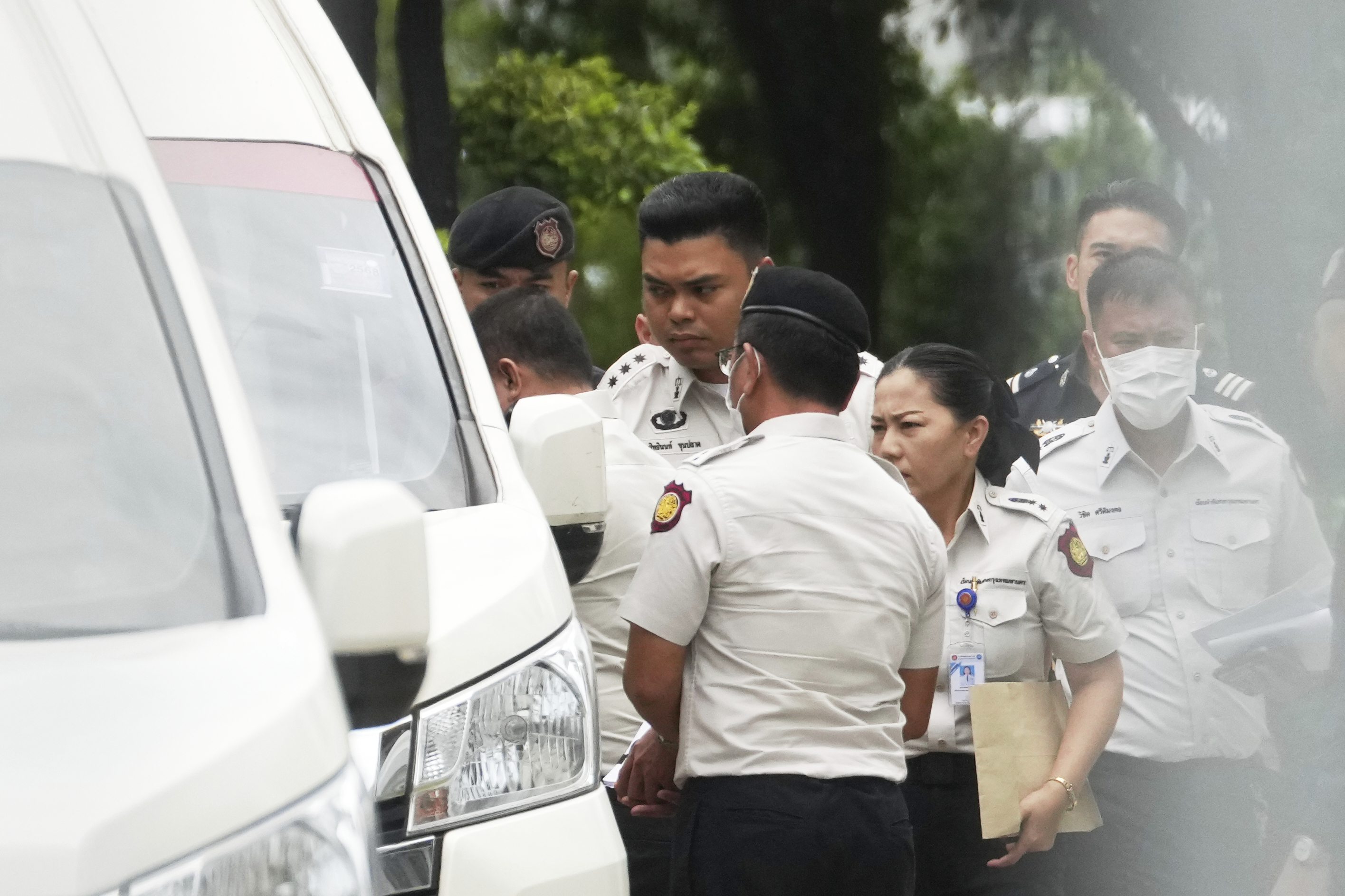 Thailand's former Prime Minister Thaksin Shinawatra, partly seen at left, leaves the Supreme Court for Bangkok Remand Prison in Bangkok, Thailand, Tuesday, Sept. 9, 2025, (Skchai Lalit - AP)