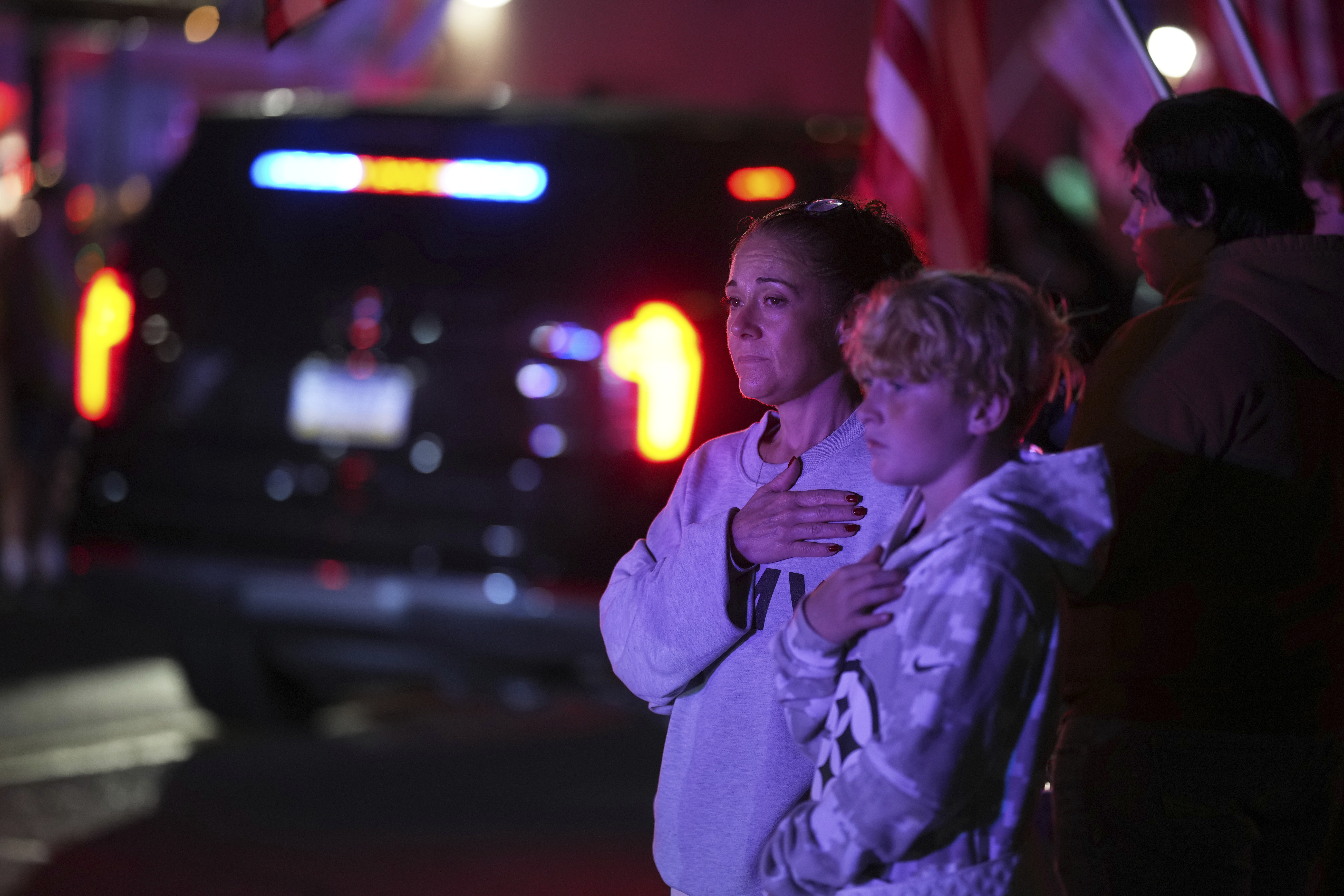 Attendees look on during a procession Wednesday, Sept. 17, 2025, in Spring Grove, Pa., after multiple police officers were shot and killed. (Matt Slocum - AP)