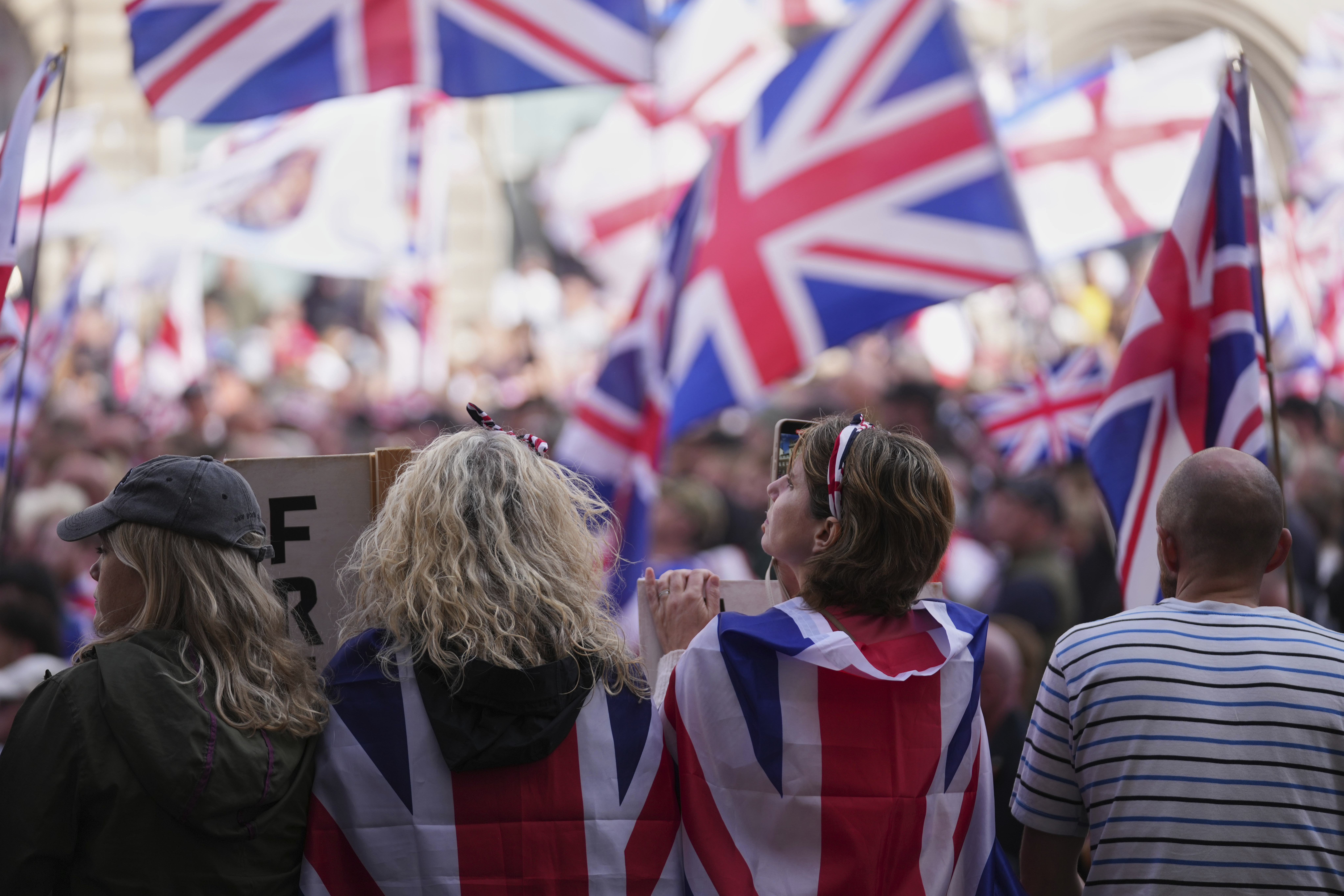 People demonstrate during the Tommy Robinson-led Unite the Kingdom march and rally, in London Saturday Sept. 13, 2025. (Joanna Chan - AP)