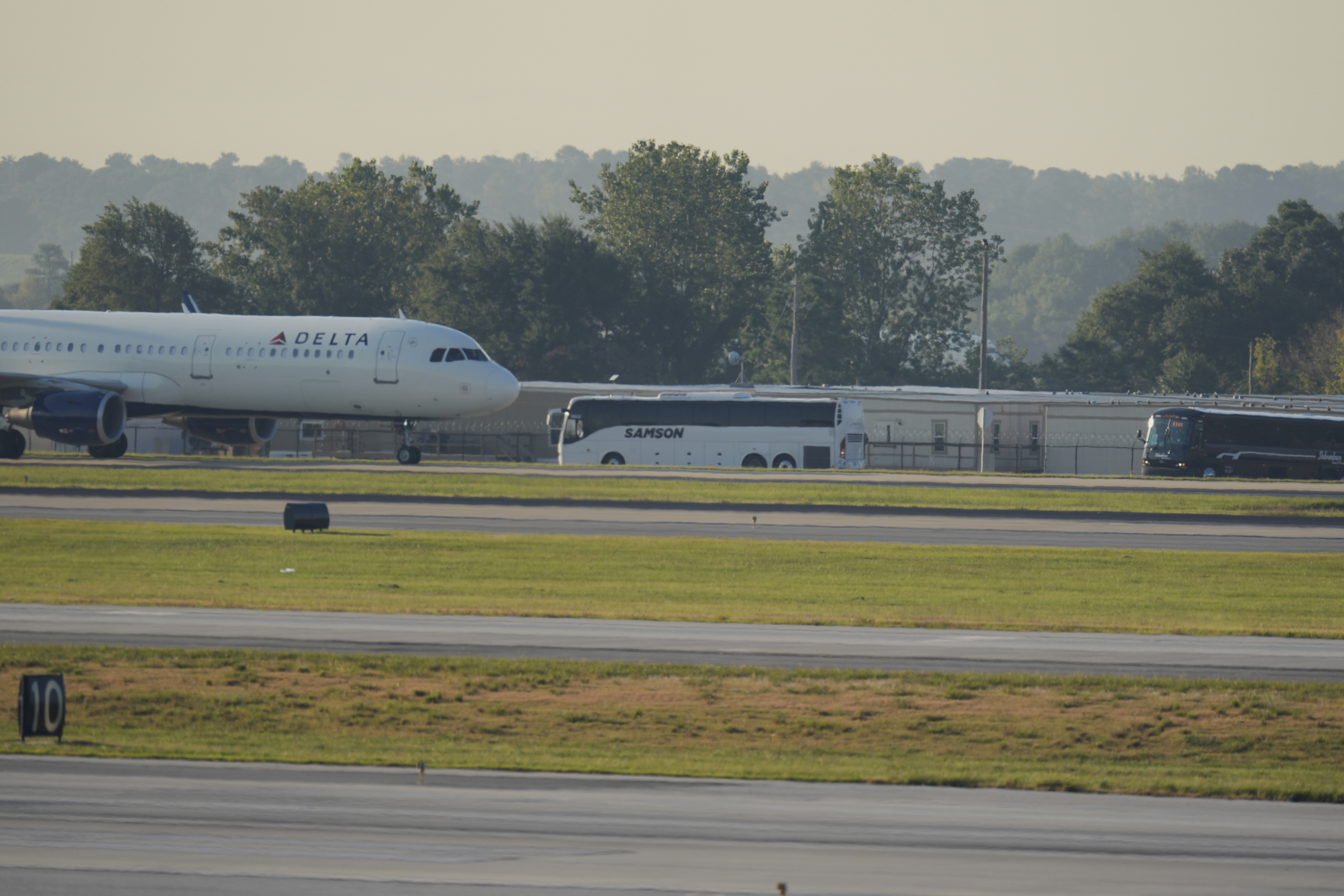 Buses carrying Korean workers detained arrives at Hartsfield-Jackson International Airport in Atlanta, Thursday, Sept. 11, 2025. (George Walker IV - AP)