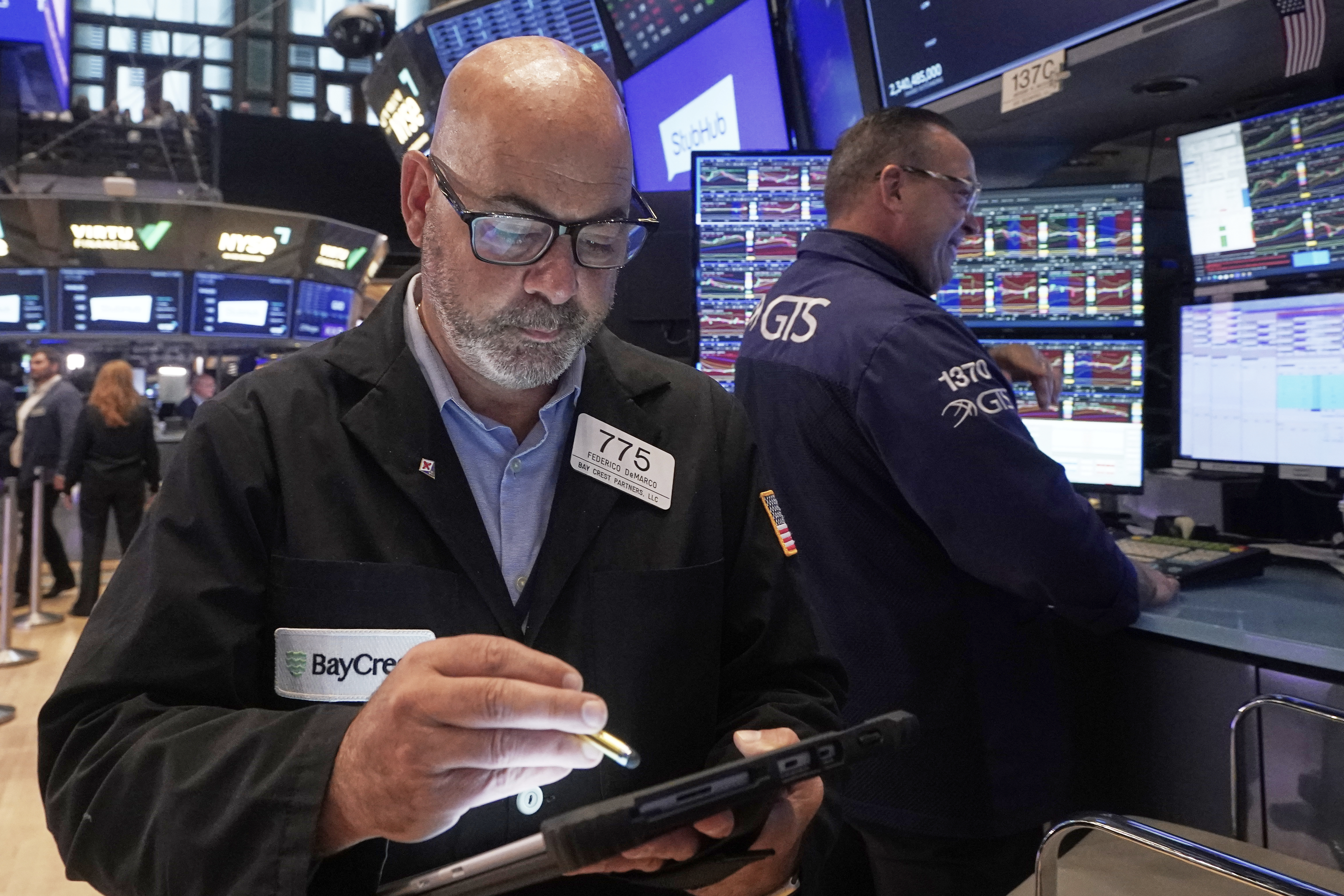 Trader Fred Fred Demarco, left, works on the floor of the New York Stock Exchange, Wednesday, Sept. 17, 2025. (Richard Drew - AP)