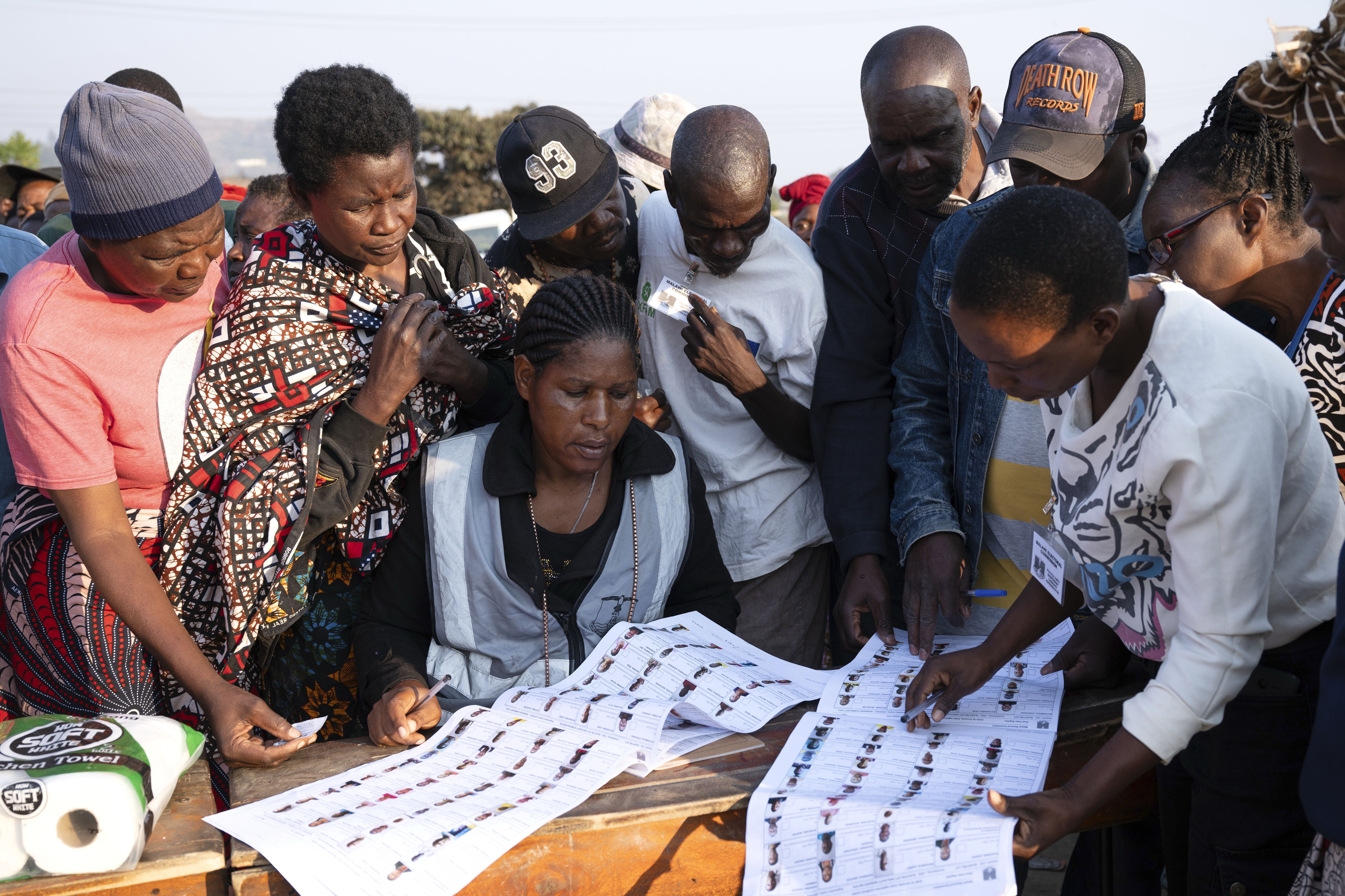 Election worker check names from electoral rolls at a polling station in Blantyre, Malawi, Tuesday, Sept. 16, 2025. (Thoko Chikondi - AP)