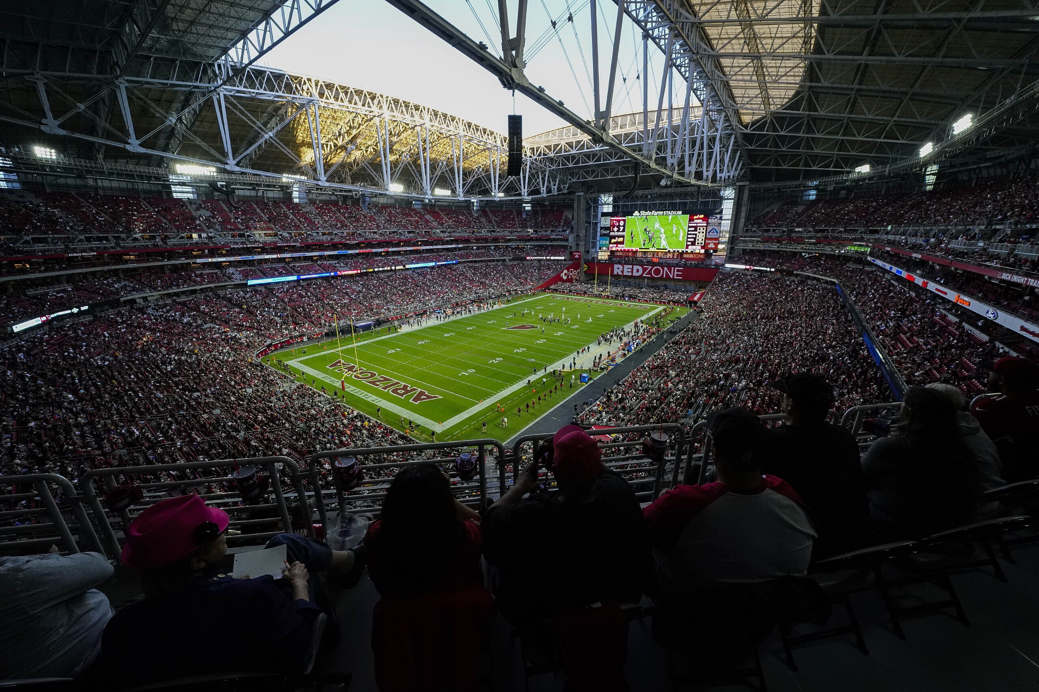 FILE - Spectators attend an NFL football game at State Farm Stadium in Glendale, Ariz., on Thursday, Oct. 20, 2022. (Darryl Webb - FR170361 AP)