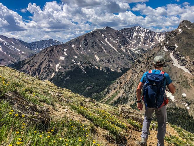 Spencer McKee descends a trail from the summit of Mount Massive. Photo Credit: Mariah Hoffman