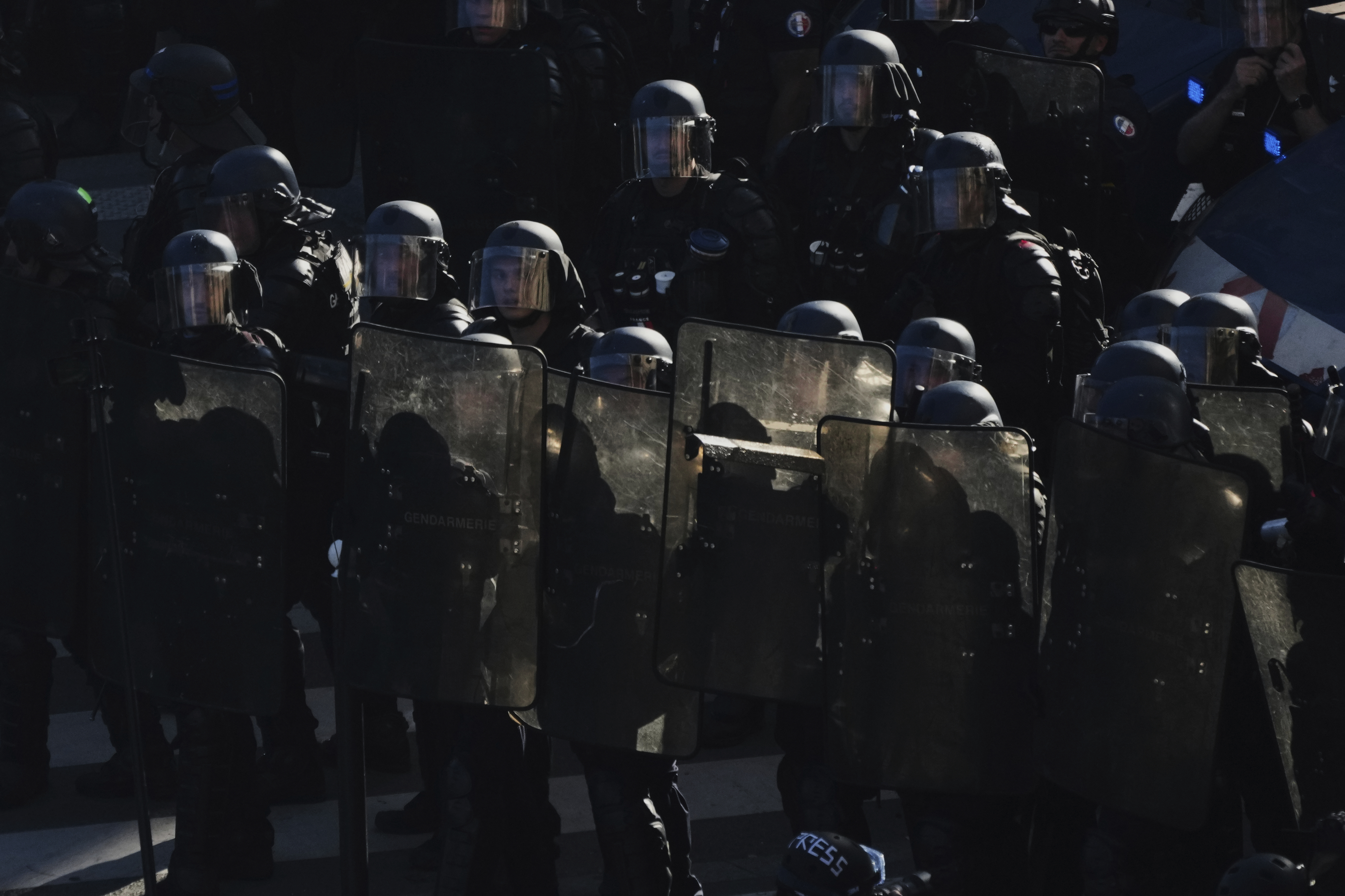 Police officers stand guard during a demonstration called by major trade unions to oppose budget cuts, in Paris, France, Thursday, Sept. 18, 2025. (Aurelien Morissard - AP)
