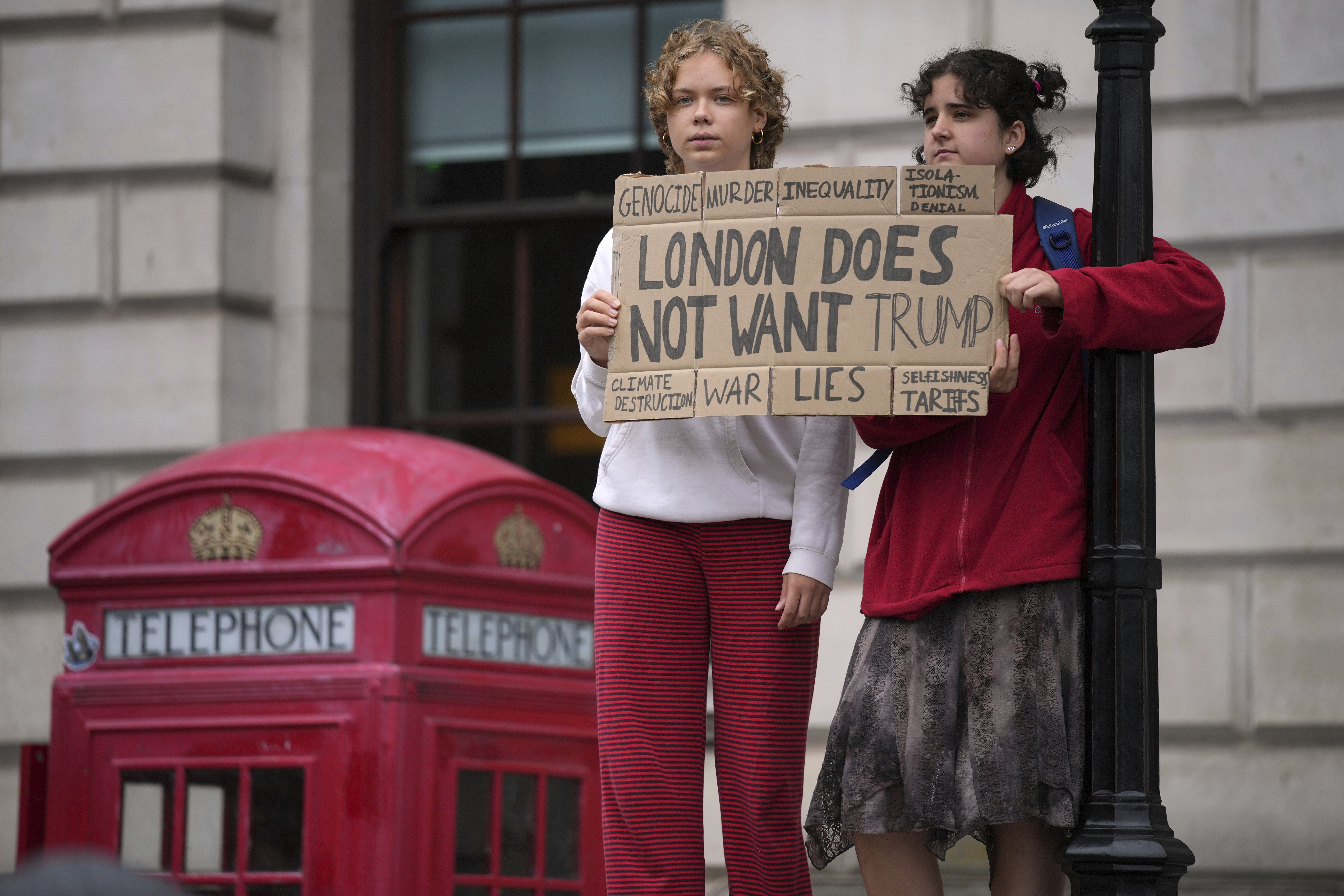 Protesters hold a placard during a demonstration of the Stop Trump Coalition group against President Donald Trump's state visit in London, Wednesday, Sept. 17, 2025. (Kin Cheung - AP)