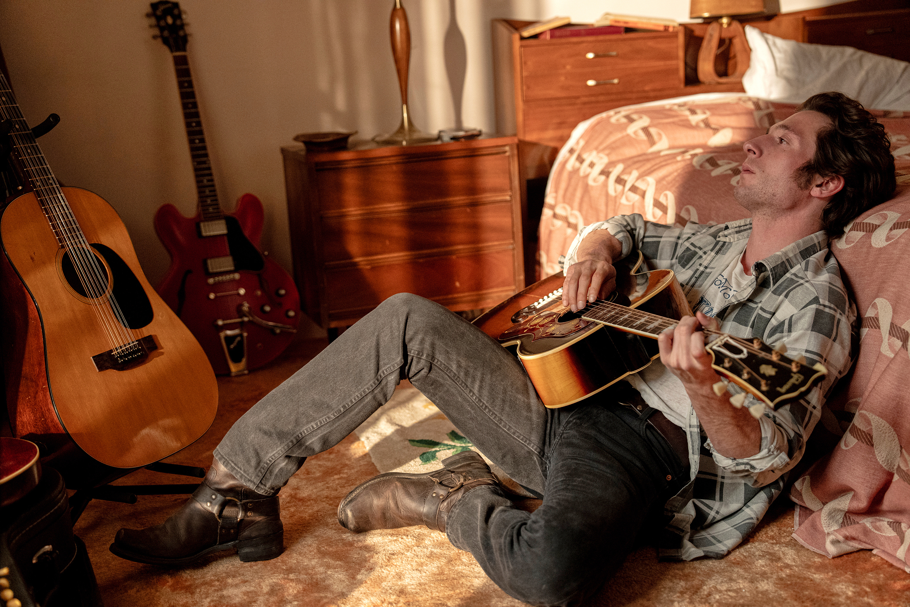 This image released by Disney shows Jeremy Allen White as Bruce Springsteen in a scene from 