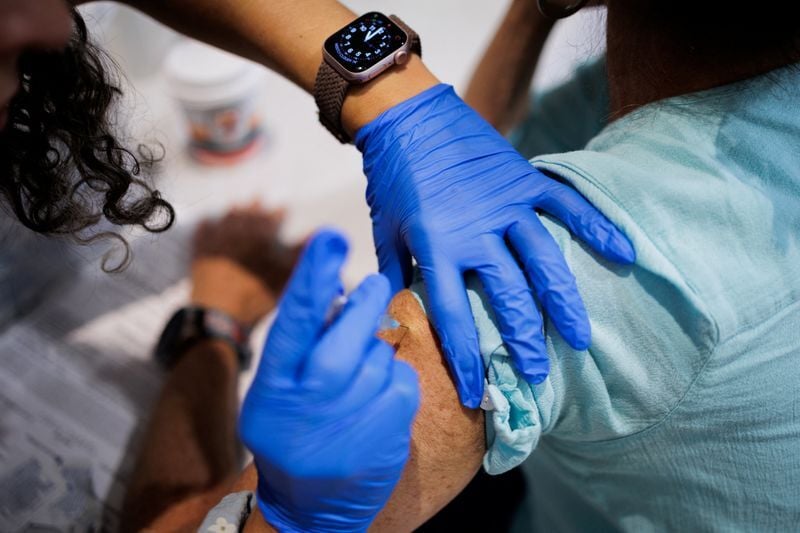 People receive coronavirus disease (COVID-19) vaccine in Lansdale