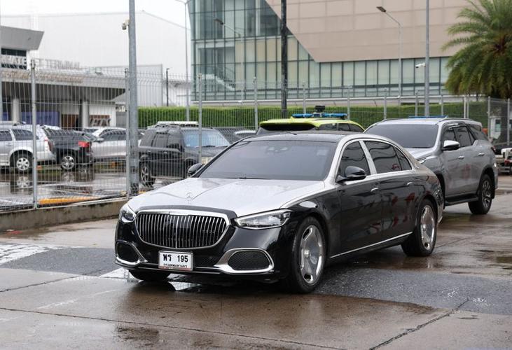 Motorcade believed to be carrying Thailand's former Prime Minister Thaksin Shinawatra drives by, in Bangkok