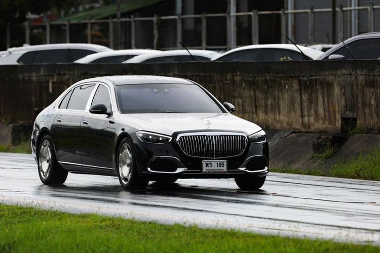 Motorcade believed to be carrying Thailand's former Prime Minister Thaksin Shinawatra drives by, in Bangkok