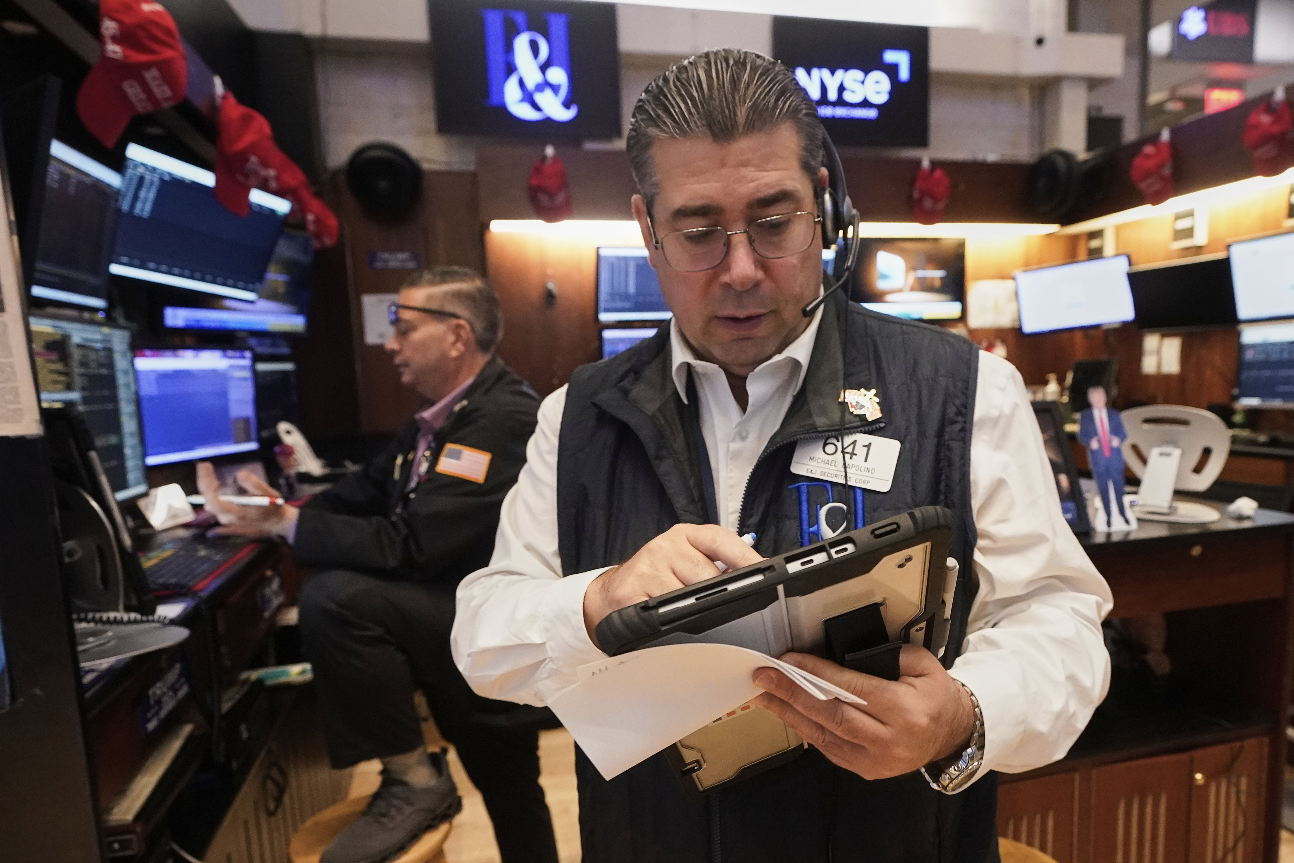 Trader Michael Capolino, right, works on the floor of the New York Stock Exchange, Wednesday, Sept. 17, 2025. (Richard Drew - AP)