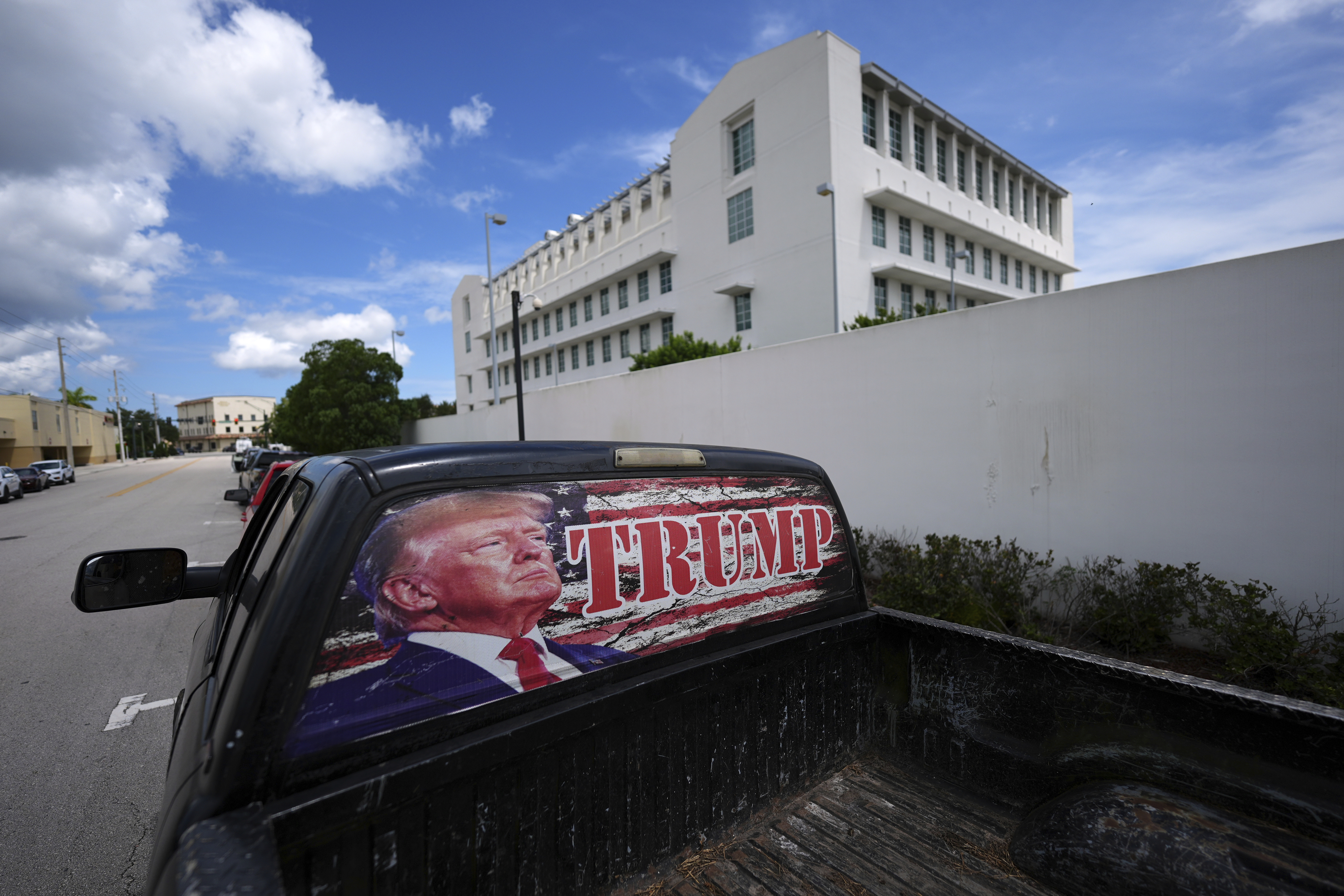 A pickup truck decorated in support of President Donald Trump sits parked outside the Alto Lee Adams Sr. U.S. Courthouse, after the start of jury selection in the trial of Ryan Routh, charged with trying to assassinate Trump while he played golf last year in South Florida, Monday, Sept. 8, 2025, in Fort Pierce, Fla. (Rebecca Blackwell - AP)