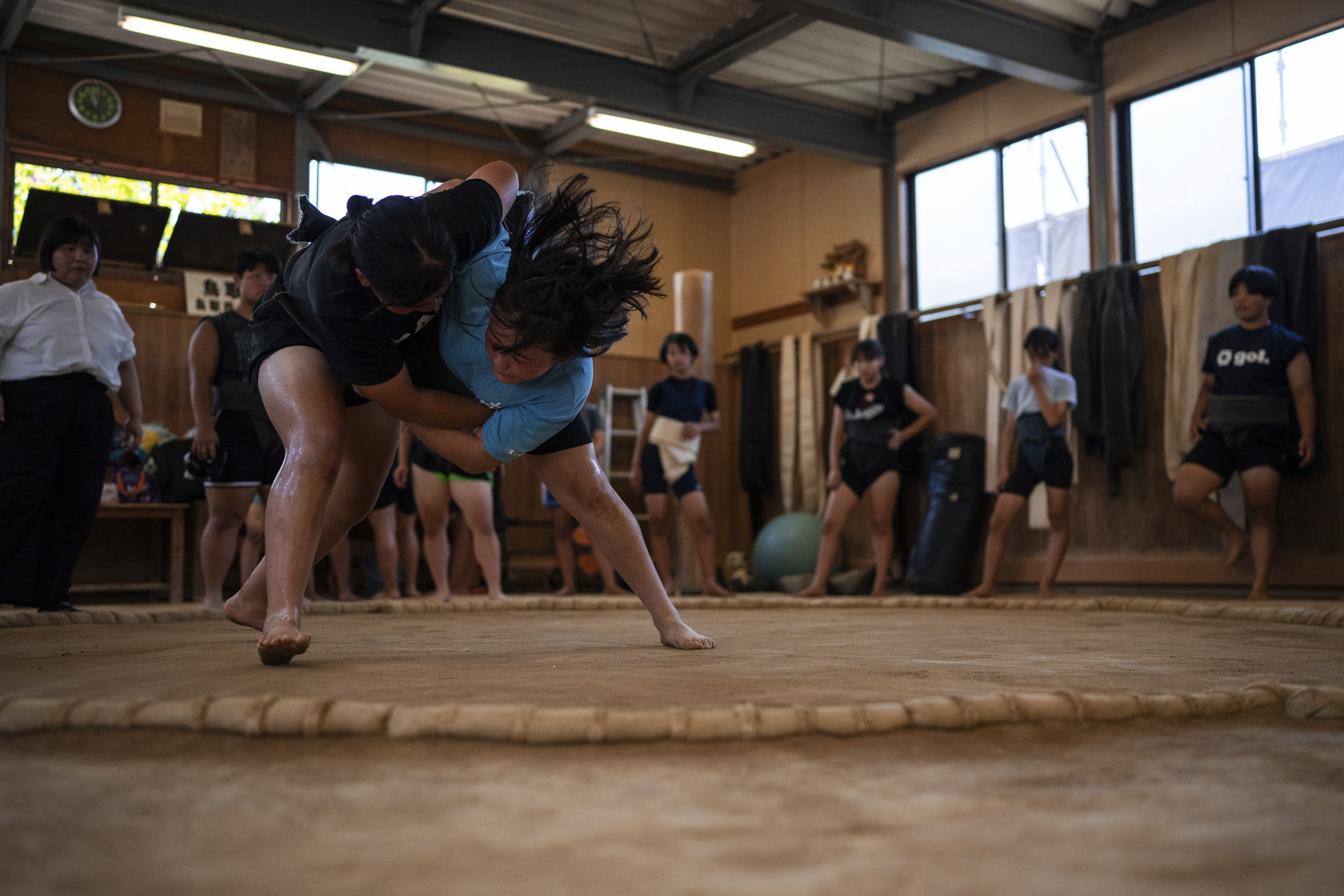 Wrestlers train during a practice session at a sumo camp in Tottori Johoku High School in Tottori, Japan, on July 29, 2025. (Louise Delmotte - AP)