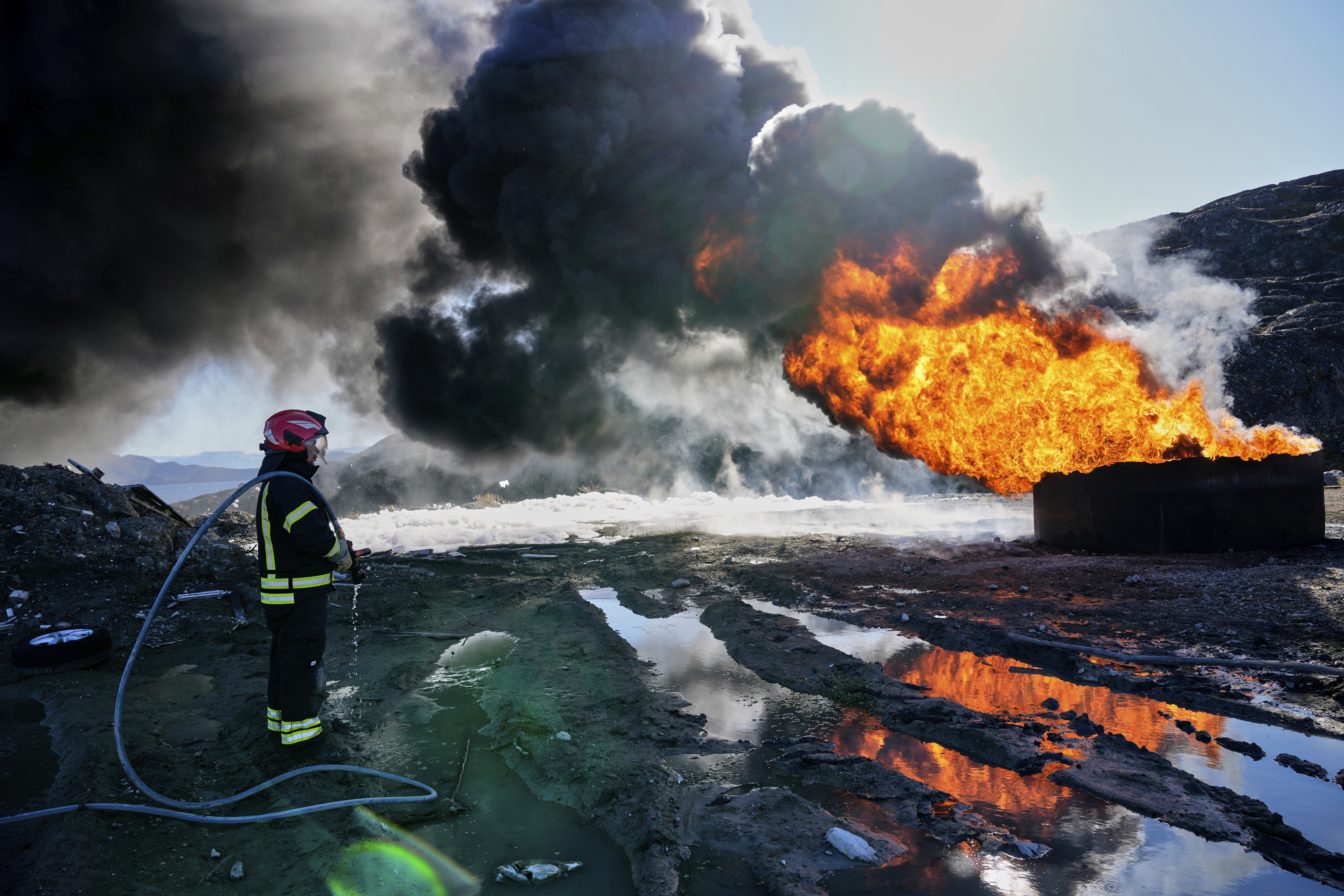 Greenlandic young firefighters participate in the Arctic basic training course supervised by the Danish army in Sisimiut, Greenland, Tuesday, Sept. 16, 2025. (Ebrahim Noroozi - AP)