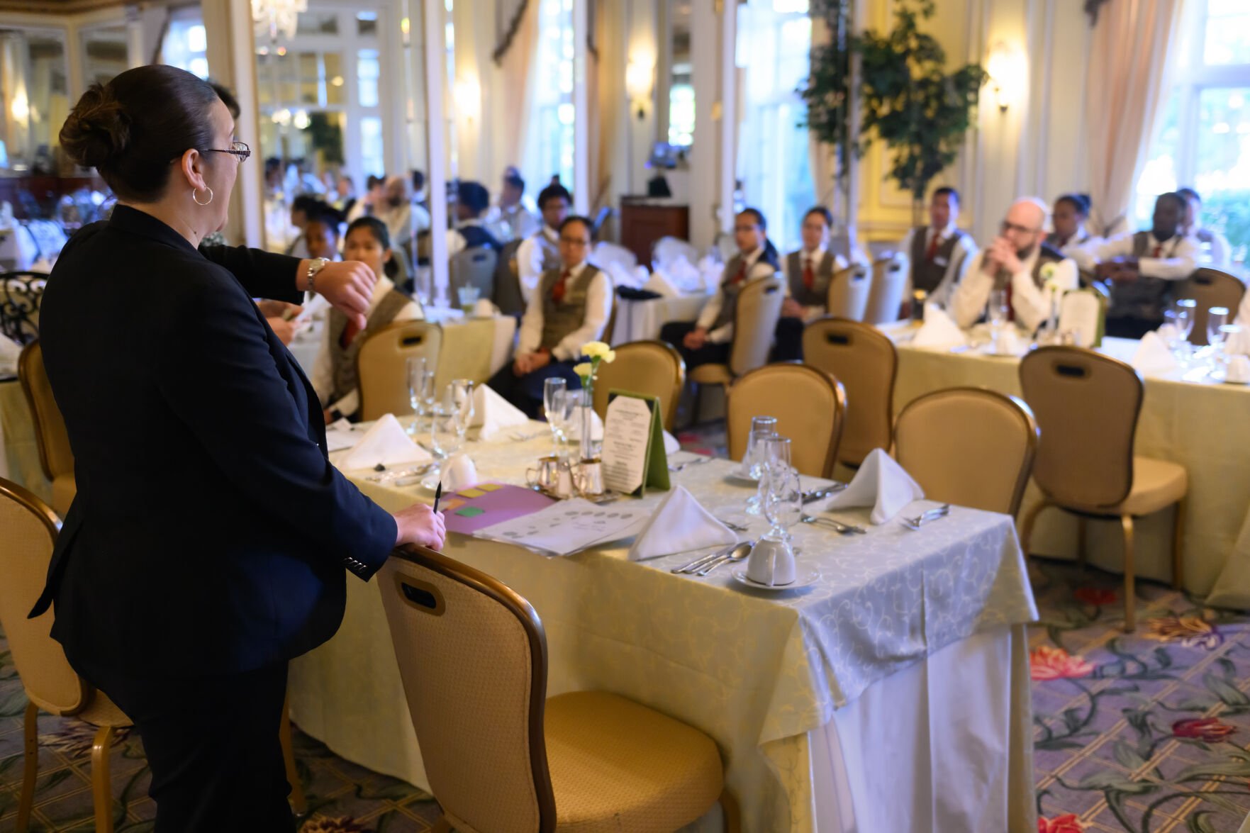 Nicole Wilson checks her watch as she briefs staff one and a half hours before the start of Sunday Brunch in the Lake Terrace Dining Room at the Broadmoor Hotel June 29, 2025. Wilson is the dining room’s General Manager. Photo by Mark Reis (Mark Reis)