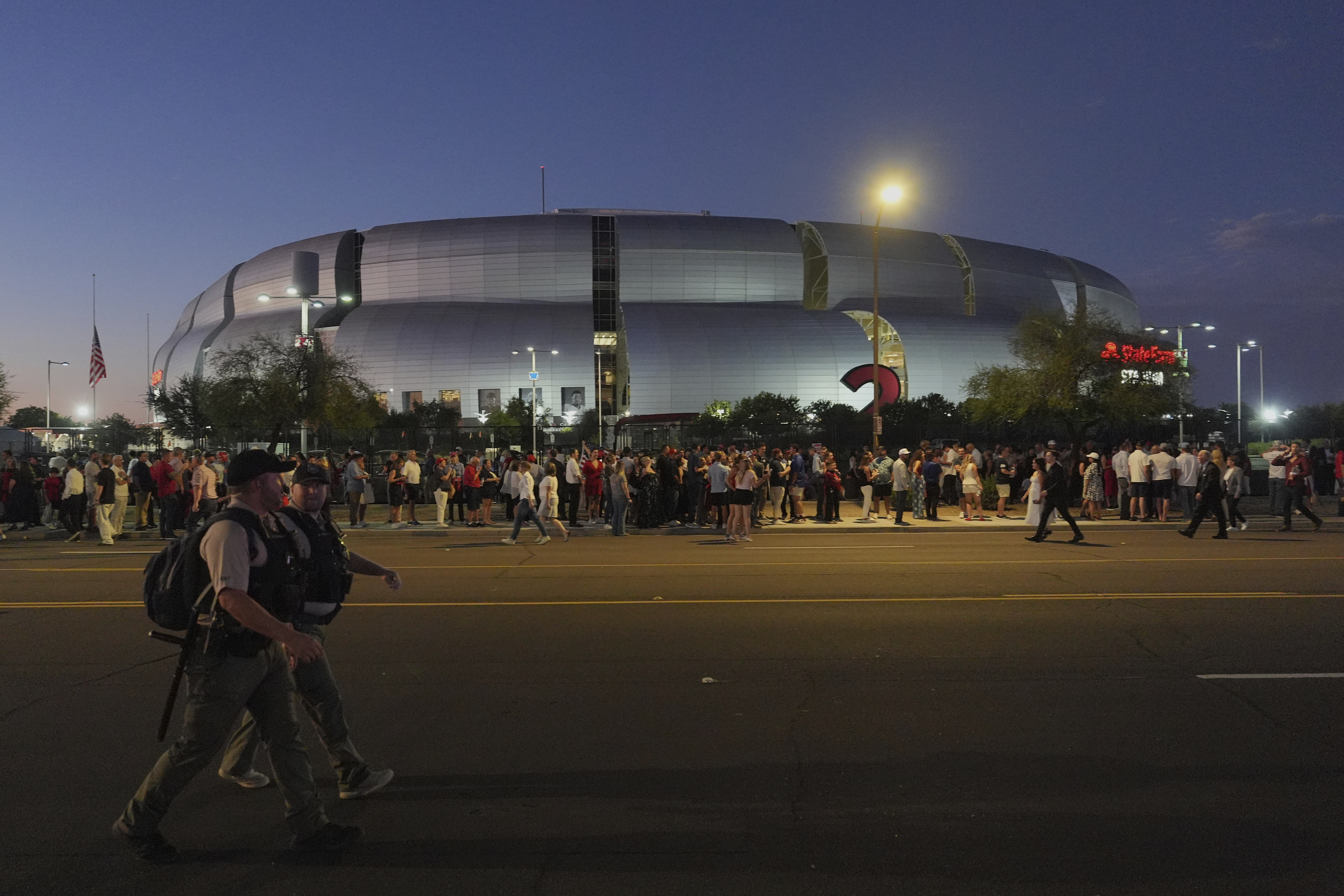 People wait in line before a memorial for conservative activist Charlie Kirk Sunday, Sept. 21, 2025, at State Farm Stadium in Glendale, Ariz. (Jae C. Hong - AP)