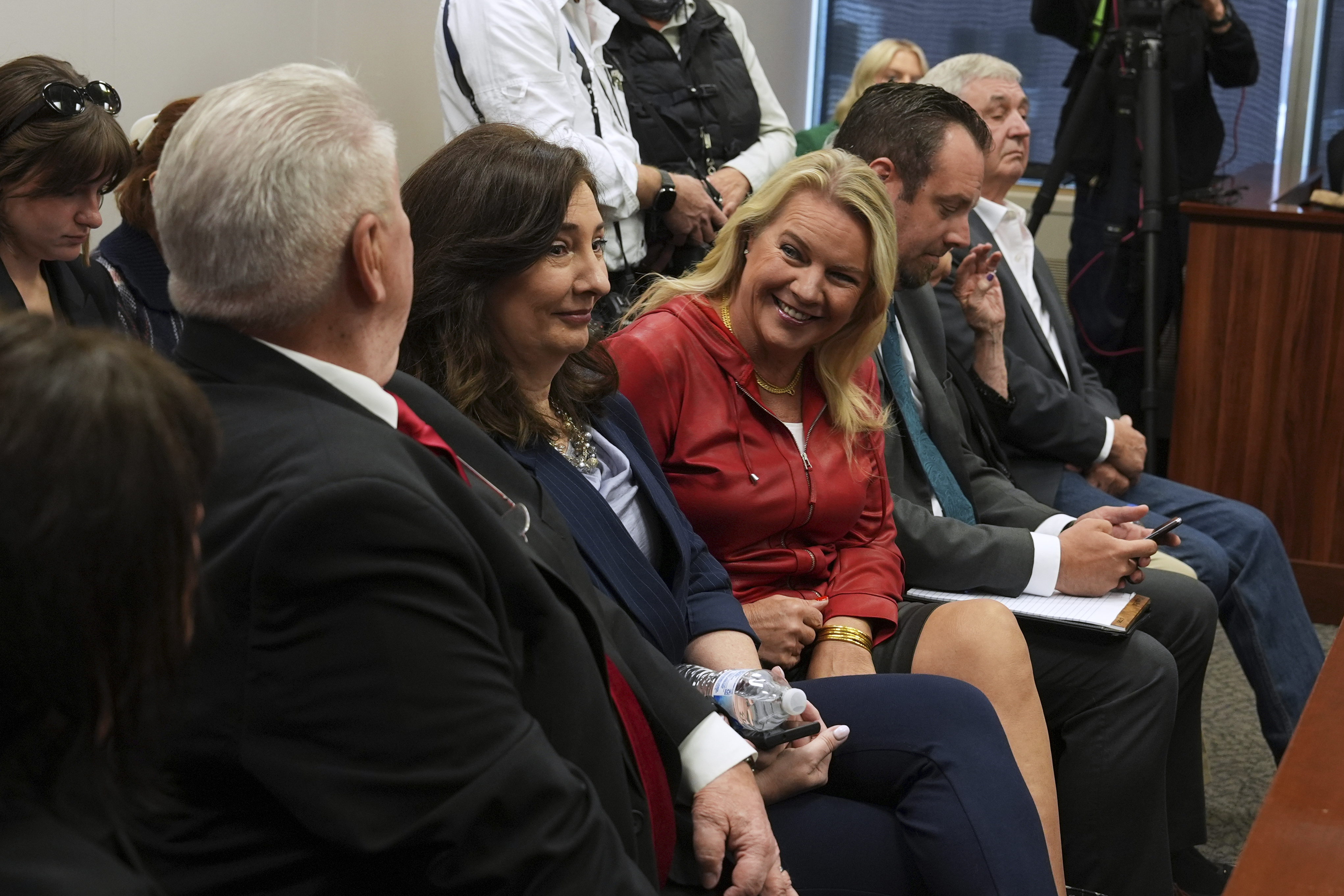 Clifford Frost, from left, Amy Facchinello, Meshawn Maddock, an unidentified attorney and Hank Choate appear during a district court hearing where a Michigan judge dismissed the criminal cases against 15 people accused of acting falsely as electors for President Donald Trump in the 2020 election Tuesday, Sept. 9, 2025 in Lansing, Mich. (Paul Sancya - AP)