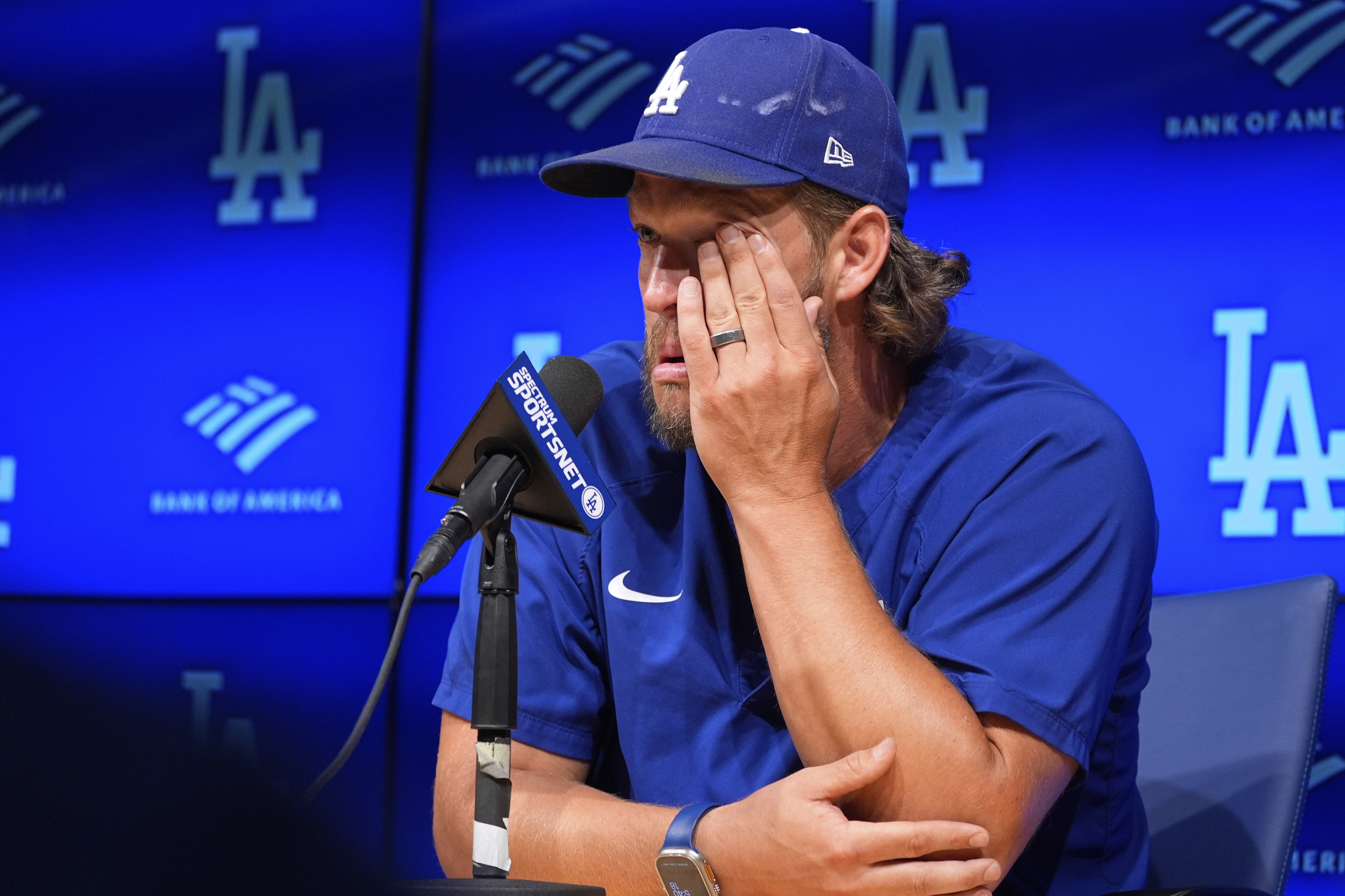 Los Angeles Dodgers pitcher Clayton Kershaw wipes his face as he speaks to the media after announcing his retirement at the end of the season prior to a baseball game against the San Francisco Giants Thursday, Sept. 18, 2025, in Los Angeles. (Mark J. Terrill - AP)