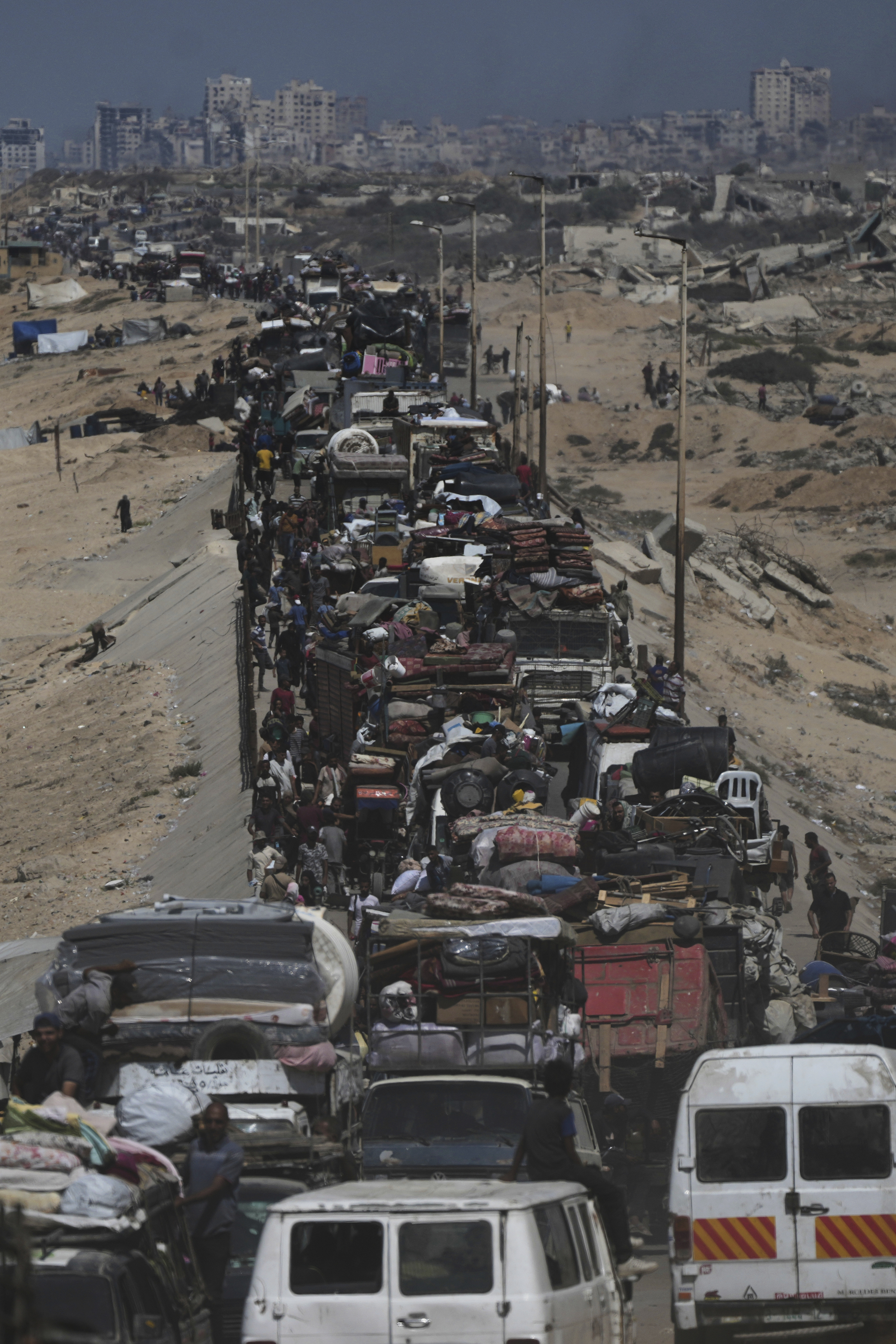 Displaced Palestinians flee Gaza City by foot and vehicles, carrying their belongings along the coastal road toward southern Gaza, Wednesday, Sept. 17, 2025. (Abdel Kareem Hana - AP)