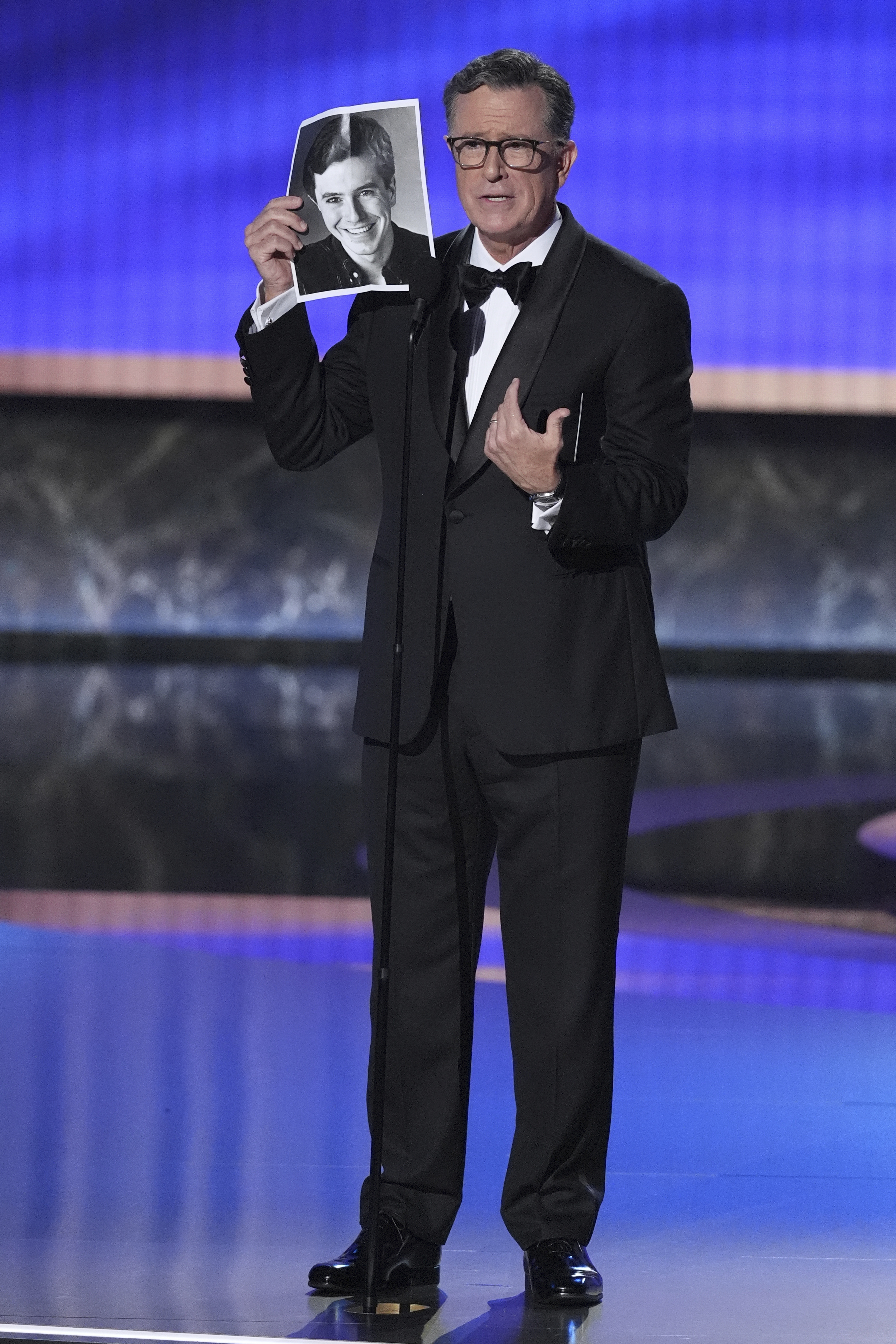 Stephen Colbert presents the award for outstanding lead actor in a comedy series during the 77th Primetime Emmy Awards on Sunday, Sept. 14, 2025, at the Peacock Theater in Los Angeles. (Chris Pizzello - Invision)