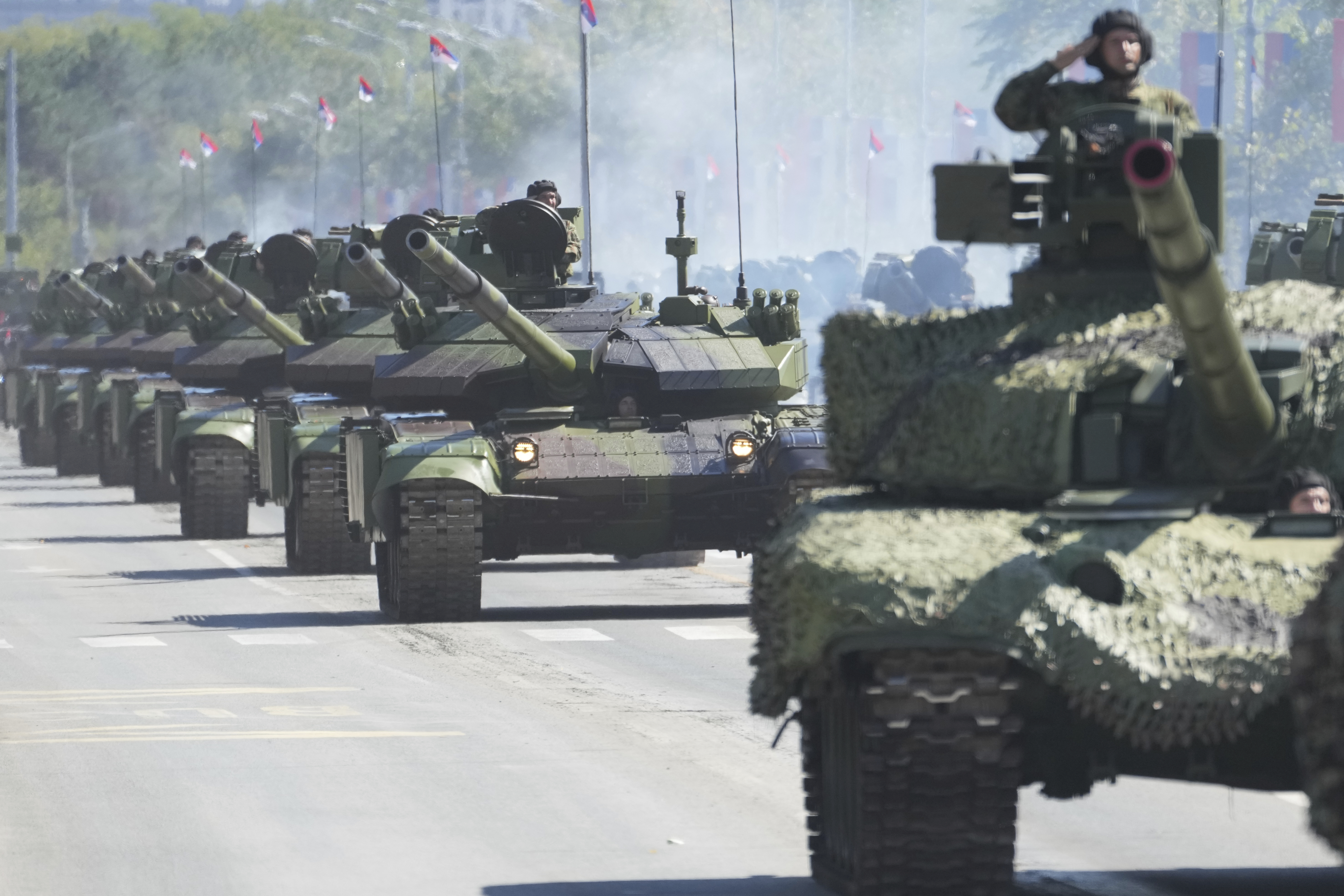 Serbia stages a large military parade to showcase tanks, jets and missile systems