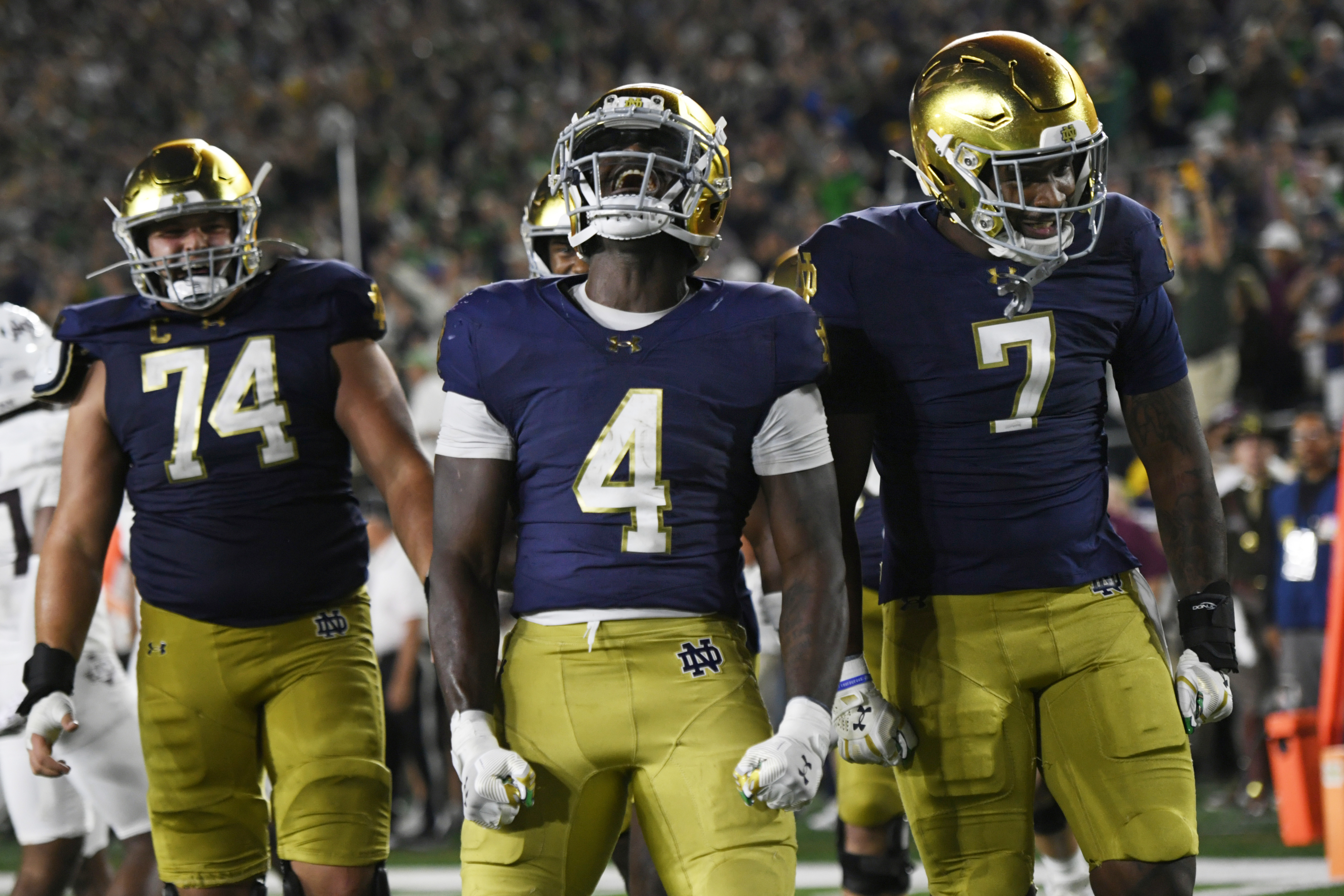 Notre Dame running back Jeremiyah Love (4) celebrates with teammates after rushing for a touchdown during the fourth quarter of an NCAA football game against Texas A&M Saturday, Sept. 13, 2025, in South Bend, Ind. (Paul Beaty - FR36811 AP)