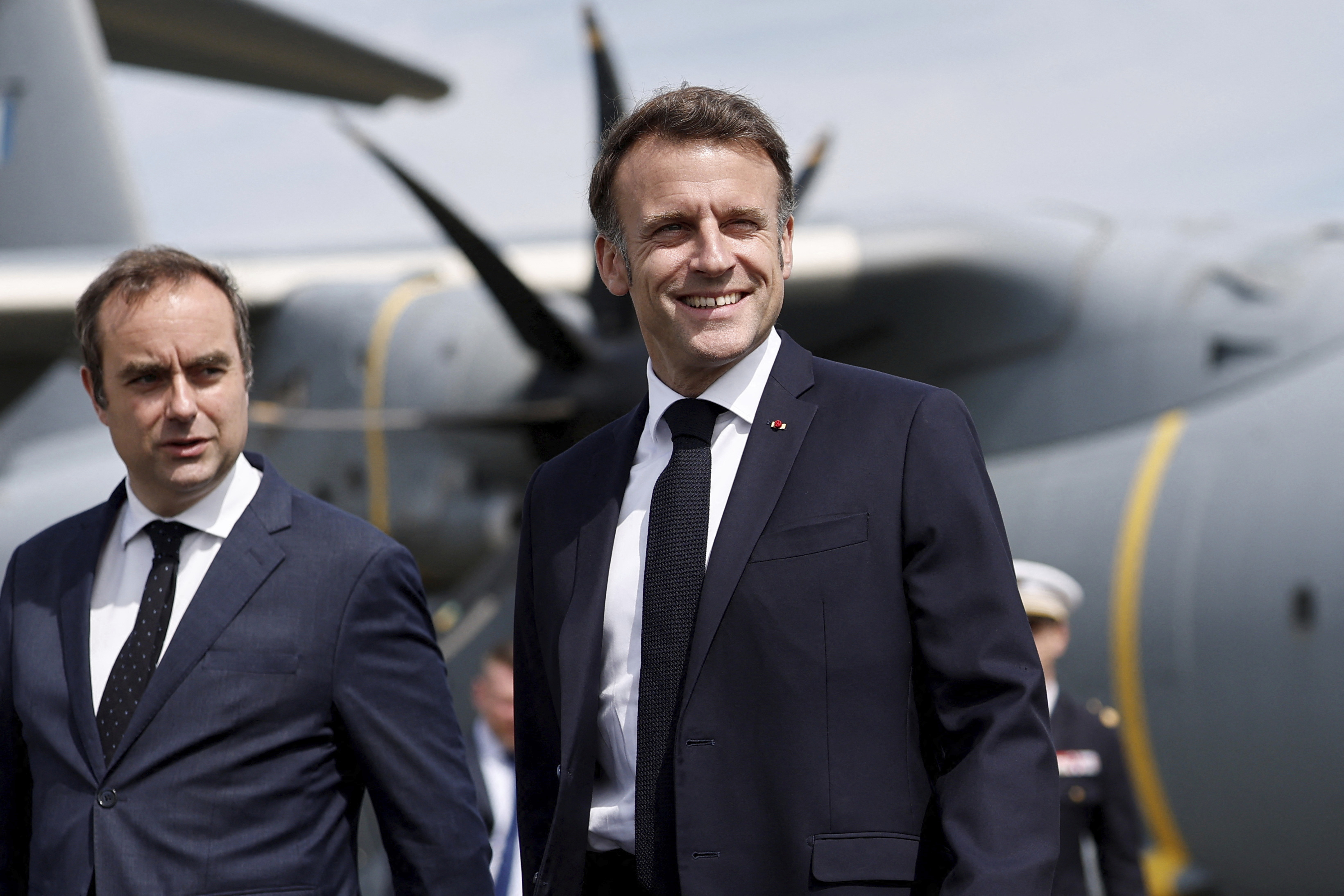 FILE - French Defense Minister Sebastien Lecornu, left, receives President Emmanuel Macron at the 55th International Paris Airshow at Le Bourget Airport near Paris, June 20, 2025. (Benoit Tessier - Reuters Pool)