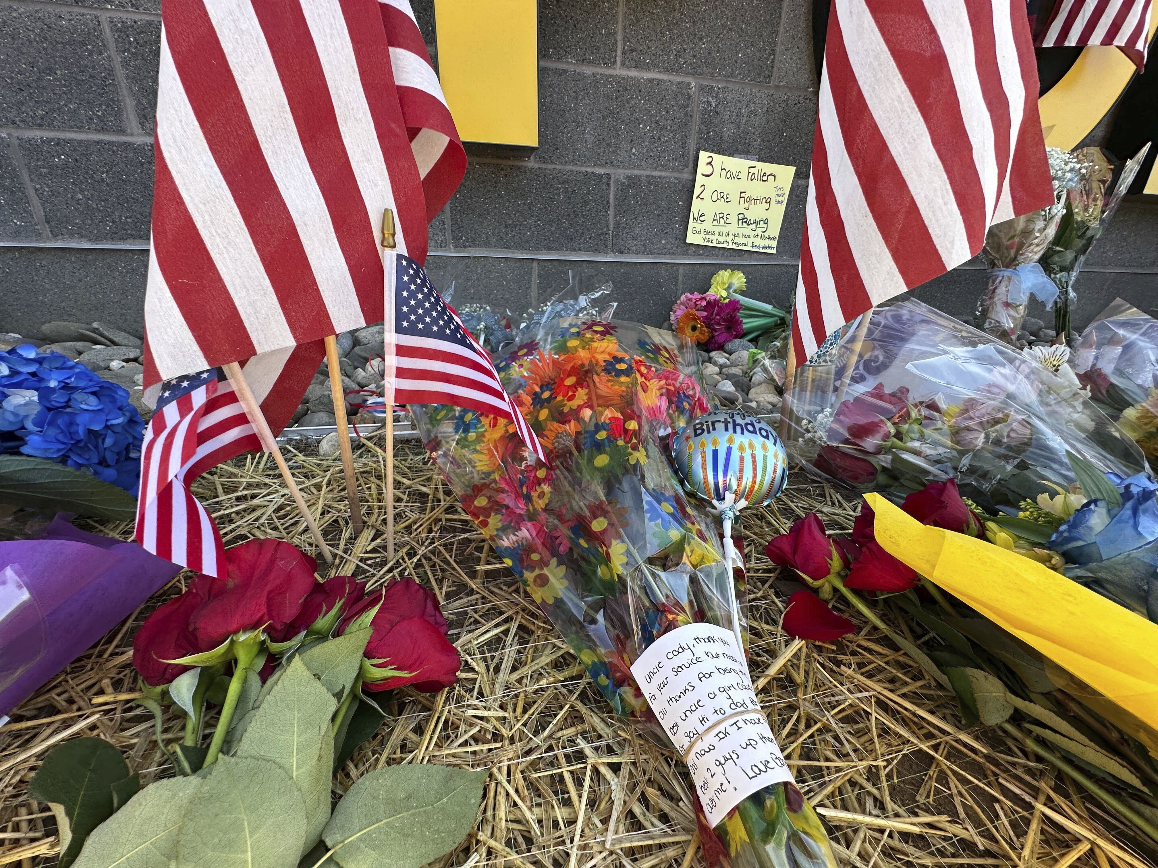 A memorial for police officers killed in a shooting is shown outside the Northern York County Regional Police Department, Thursday, Sept. 18, 2025 in York, Pa. (Tassanee Vejpongsa - AP)