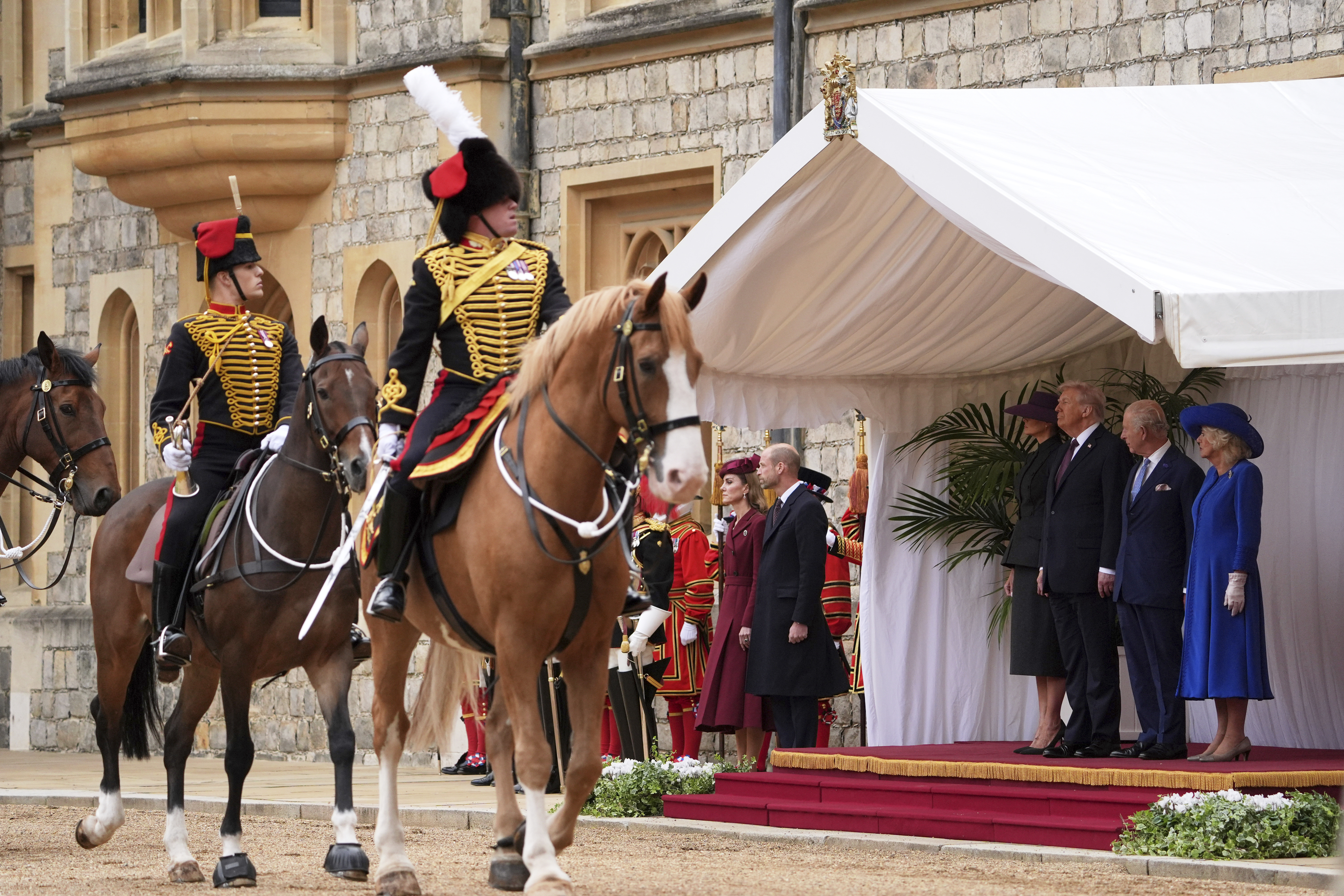 From left, Britain's Kate, Princess of Wales, Britain's Prince William, President Donald Trump and first lady Melania Trump, Britain's King Charles III and Britain's Queen Camilla during the national anthems at an arrival ceremony at Windsor Castle, in Windsor, England, Wednesday, Sept. 17, 2025. (Evan Vucci - AP)