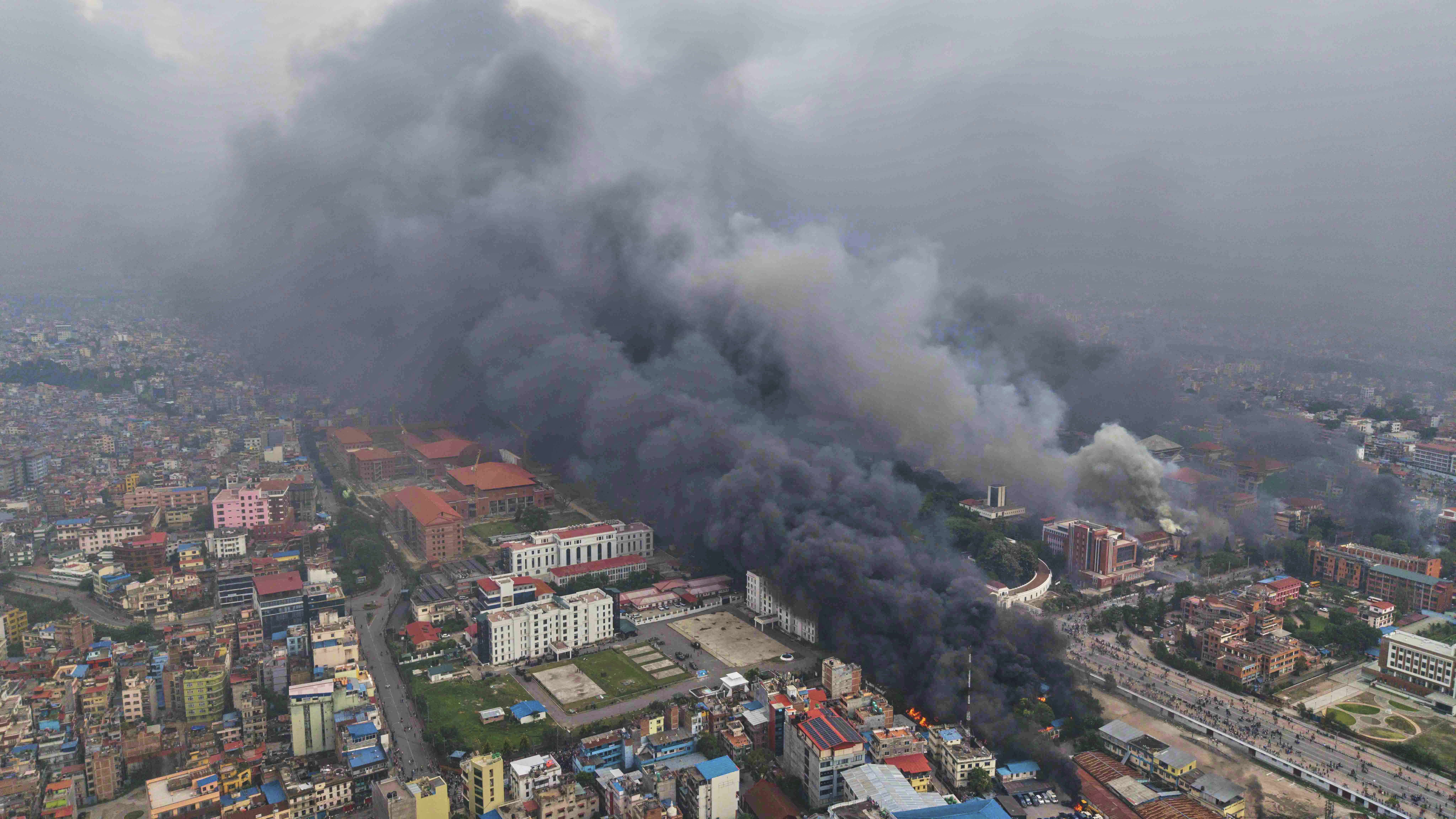 Smoke billows out from various ministries and offices after they were set on fire during a protest against social media ban and corruption in Kathmandu, Nepal, Tuesday, Sept. 9, 2025. (Prakash Timalsina - AP)