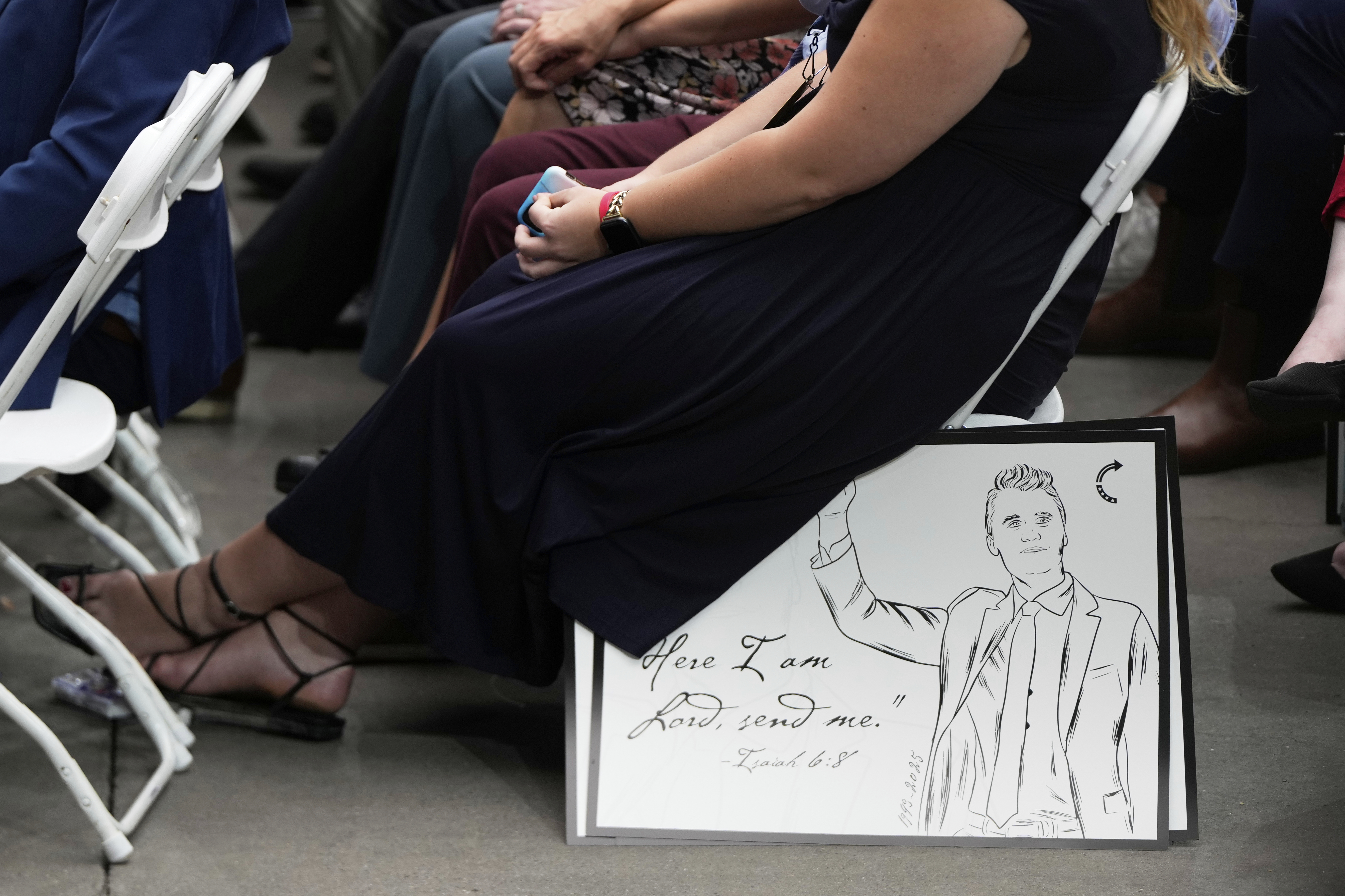 A poster depicting conservative activist Charlie Kirk is pictured as people attend Kirk's memorial, Sunday, Sept. 21, 2025, at State Farm Stadium in Glendale, Ariz. (Julia Demaree Nikhinson - AP)