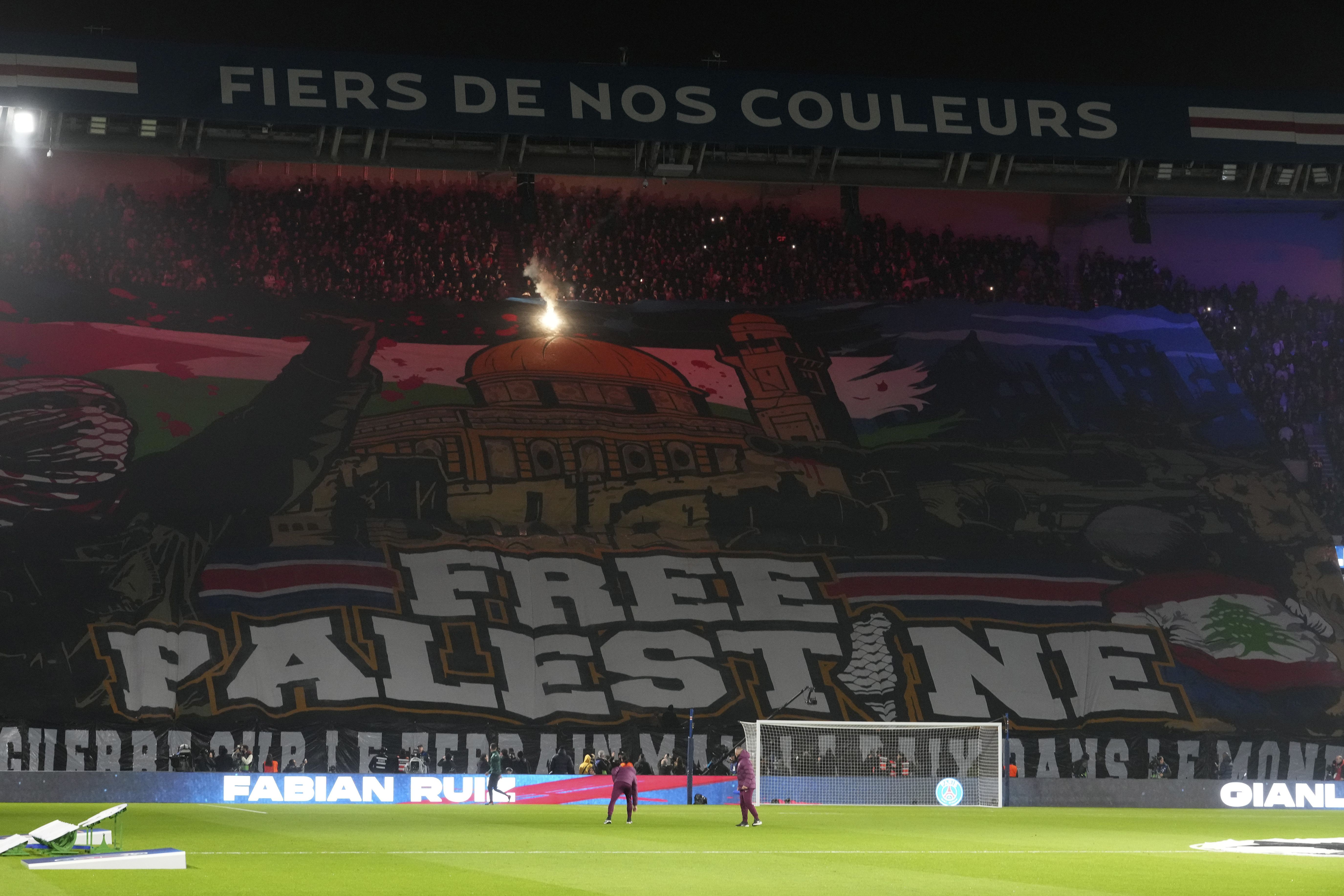 FILE - A giant banner reads