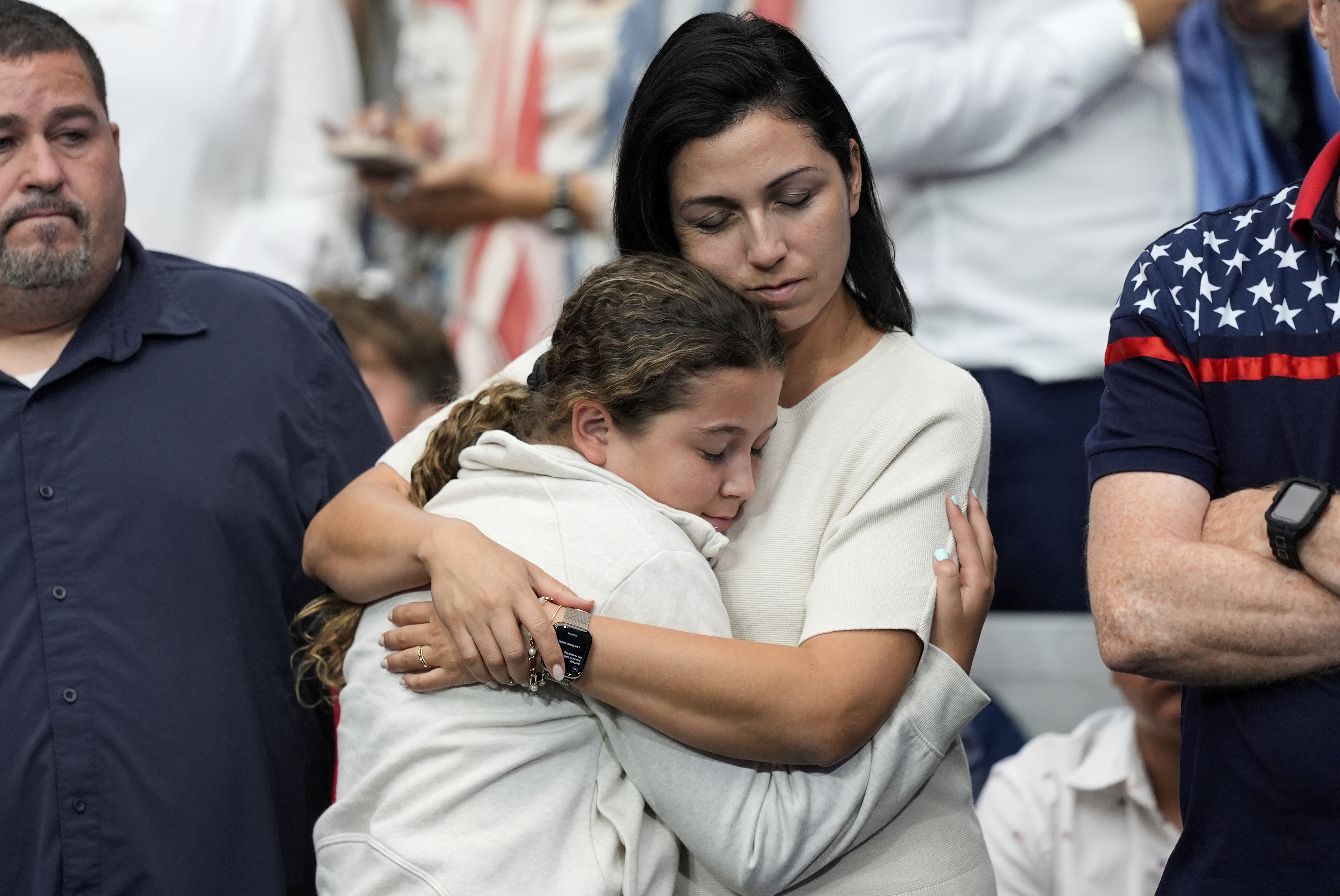 Attendees react during a memorial for conservative activist Charlie Kirk, Sunday, Sept. 21, 2025, at State Farm Stadium in Glendale, Ariz. (Julia Demaree Nikhinson - AP)