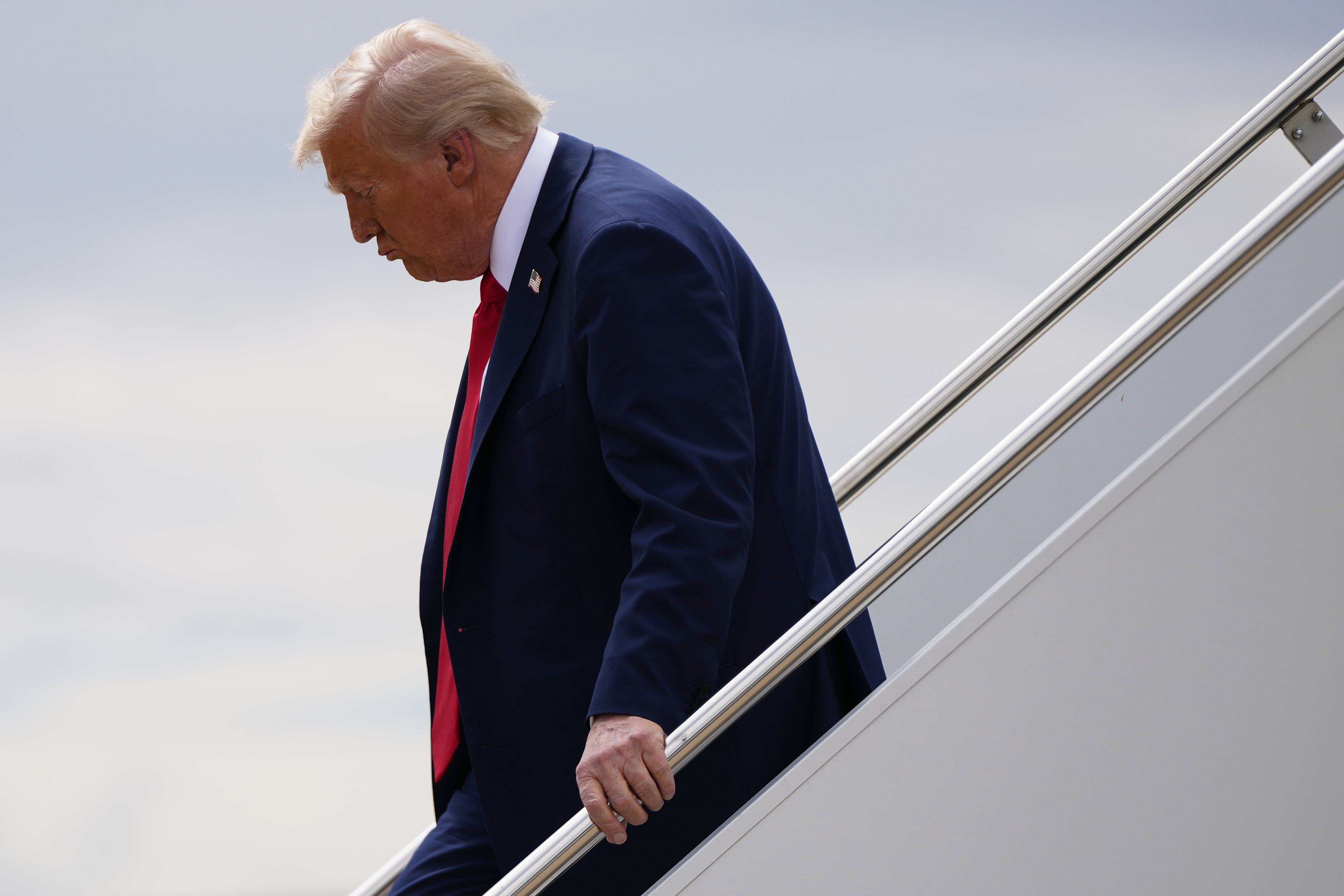President Donald Trump disembarks Air Force One, Sunday, Sept. 21, 2025, upon arriving at Luke Air Force Base, Ariz., to attend a memorial for conservative activist Charlie Kirk. (Julia Demaree Nikhinson - AP)