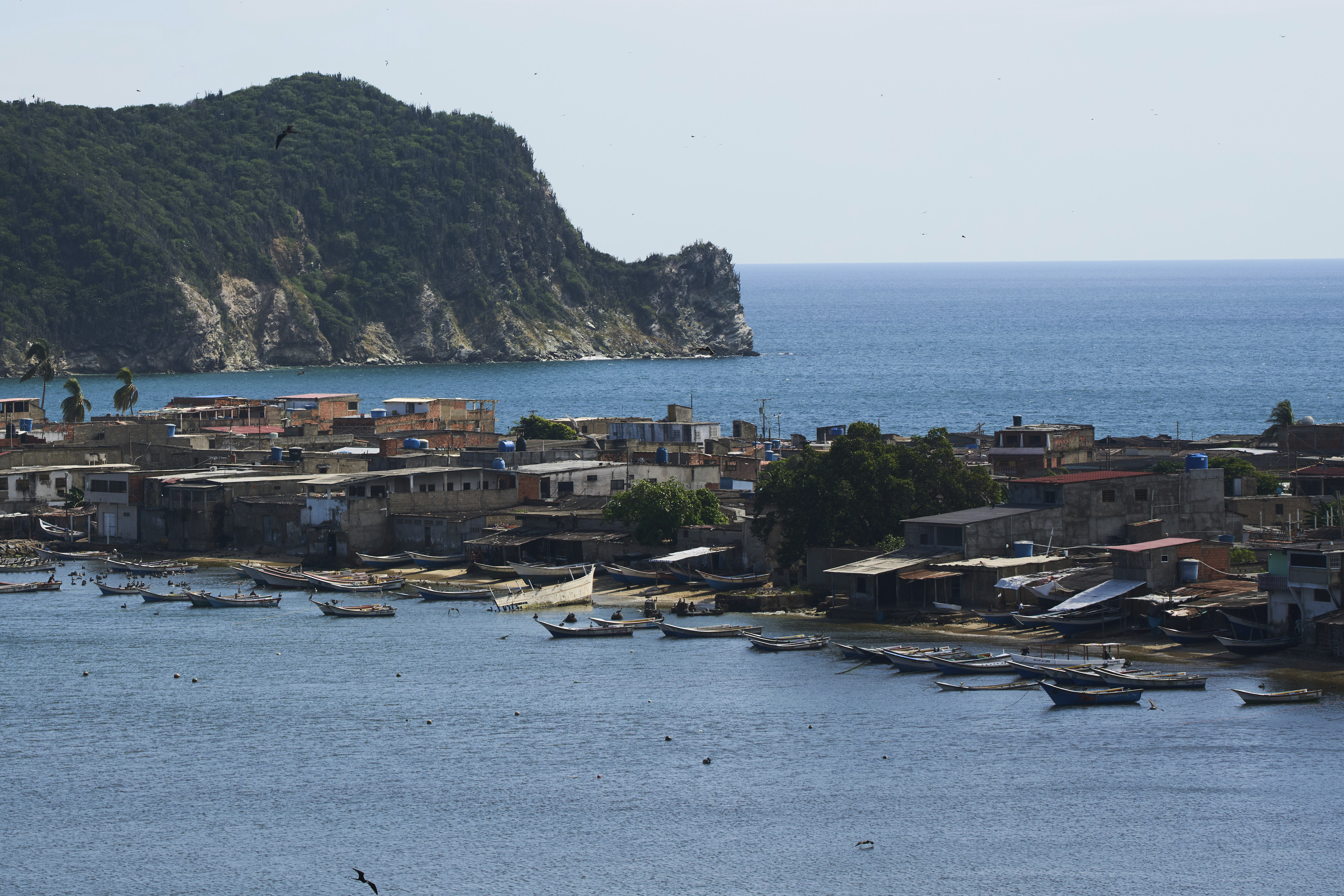 Boats are anchored off El Morro de Puerto Santo, on Venezuela's Paria Peninsula, Sunday, Sept. 14, 2025. (Ariana Cubillos - AP)