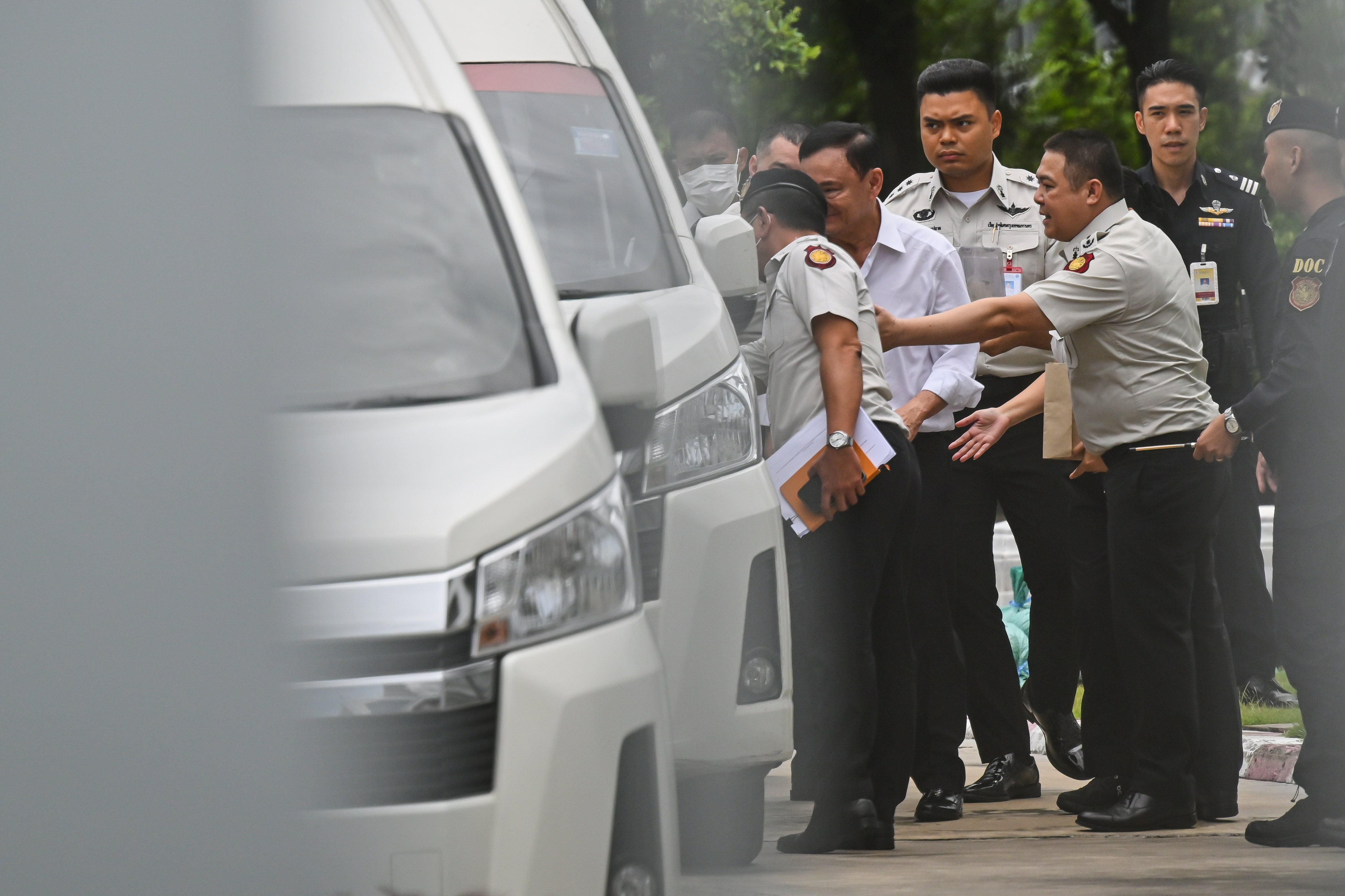 Thailand's former Prime Minister Thaksin Shinawatra, second from left, leaves the Supreme Court for Bangkok Remand Prison in Bangkok, Thailand, Tuesday, Sept. 9, 2025. (Panumas Sanguanwong - AP)