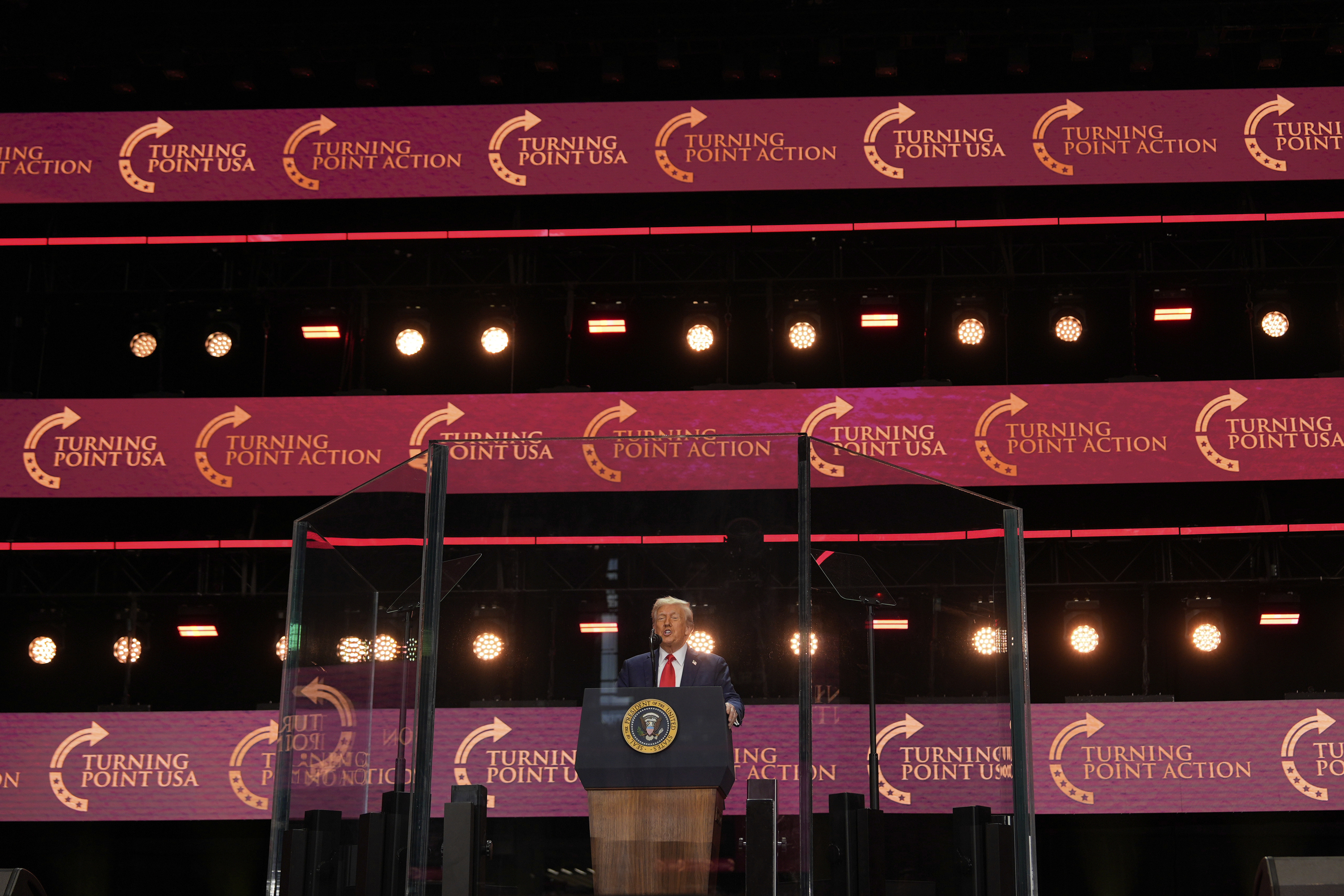 President Donald Trump speaks at a memorial for conservative activist Charlie Kirk, Sunday, Sept. 21, 2025, at State Farm Stadium in Glendale, Ariz. (Julia Demaree Nikhinson - AP)