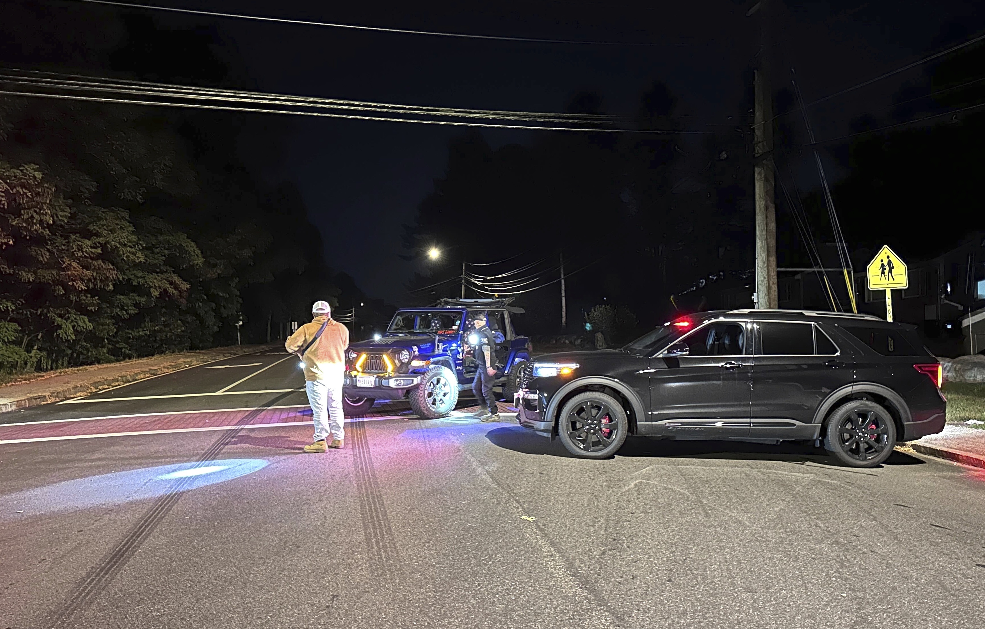 Police block a road to a country club where a shooting happened at Sky Meadow Country Club in Nashua, New Hampshire, Saturday, Sept. 20, 2025. (Michael Casey - AP)