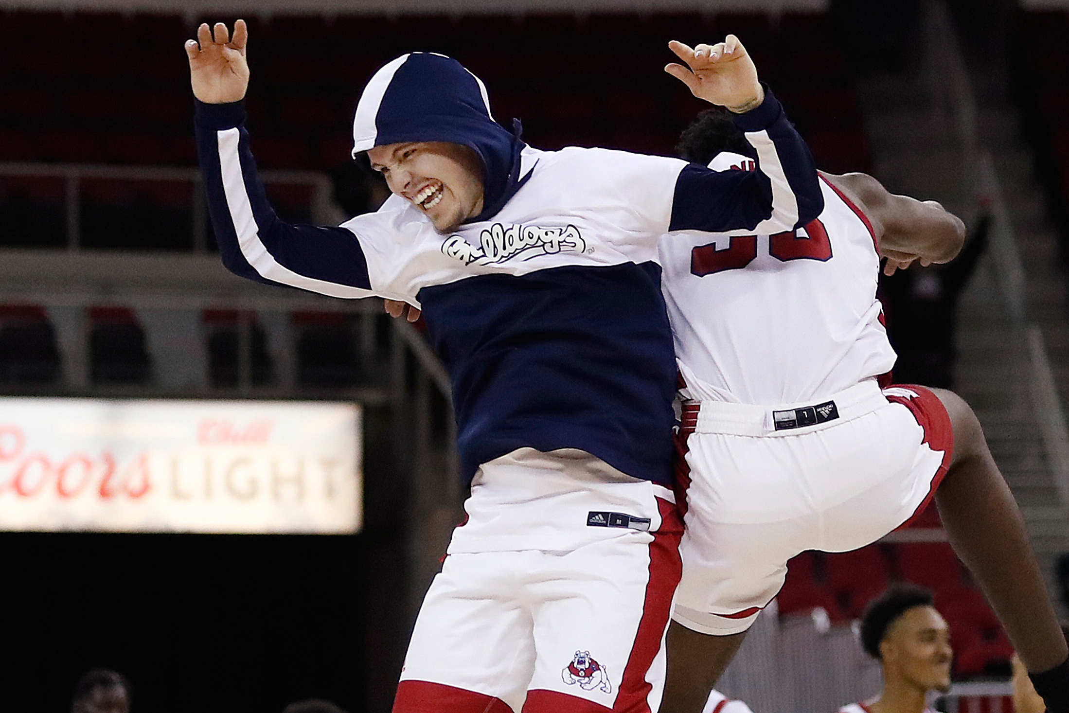 FILE - Fresno State's Steven Vasquez, left, celebrates the team's win over New Mexico following an NCAA college basketball game in Fresno, Calif., Tuesday, Jan. 3, 2023. (Gary Kazanjian - FR71556 AP)