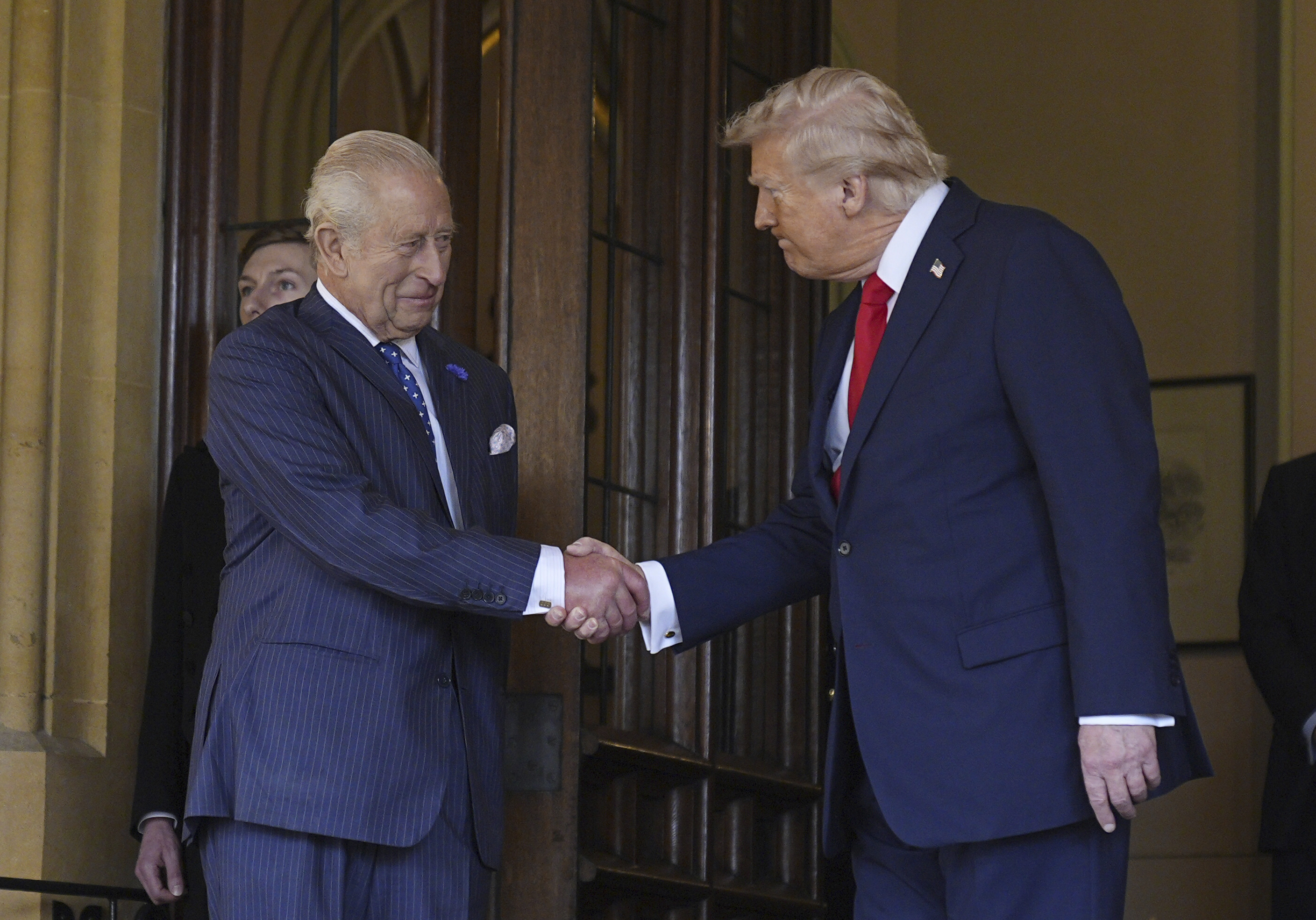 Britain's King Charles III, left, formally bids farewell to US President Donald Trump at Windsor Castle, Windsor, England, Thursday Sept. 18, 2025. (Aaron Chown - PA Pool)