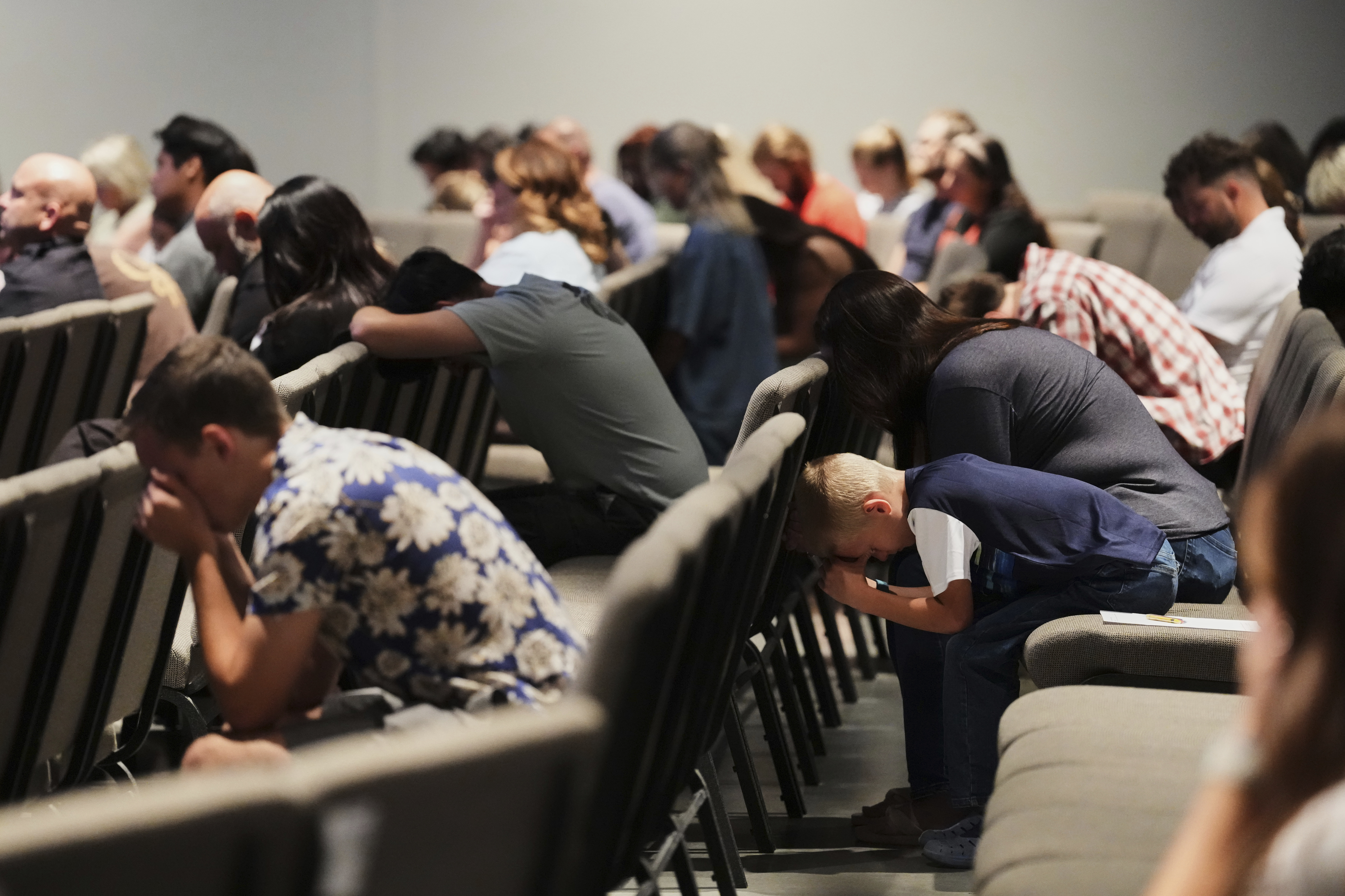 Congregants bow their heads during a prayer event at CenterPoint Church the day after Charlie Kirk, the CEO and co-founder of Turning Point USA was shot and killed, Thursday, Sept. 11, 2025, in Orem, Utah. (Lindsey Wasson - AP)